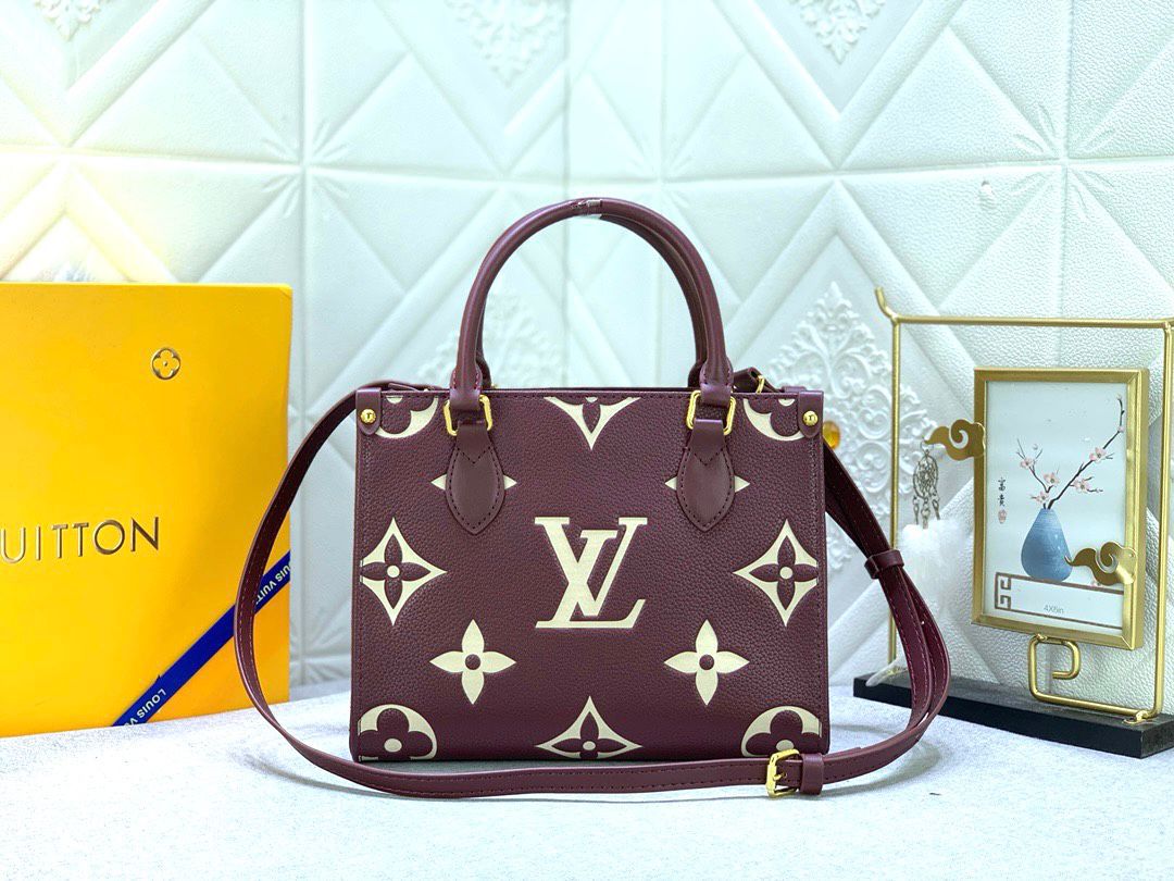 Louis Vuitton OnTheGo PM handbag in burgundy Monogram Empreinte leather. image 1