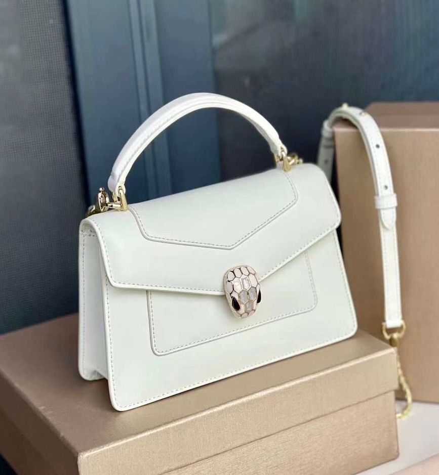 Bvlgari Serpenti Forever top handle bag in white calf leather with a light gold-plated snakehead closure. image 1