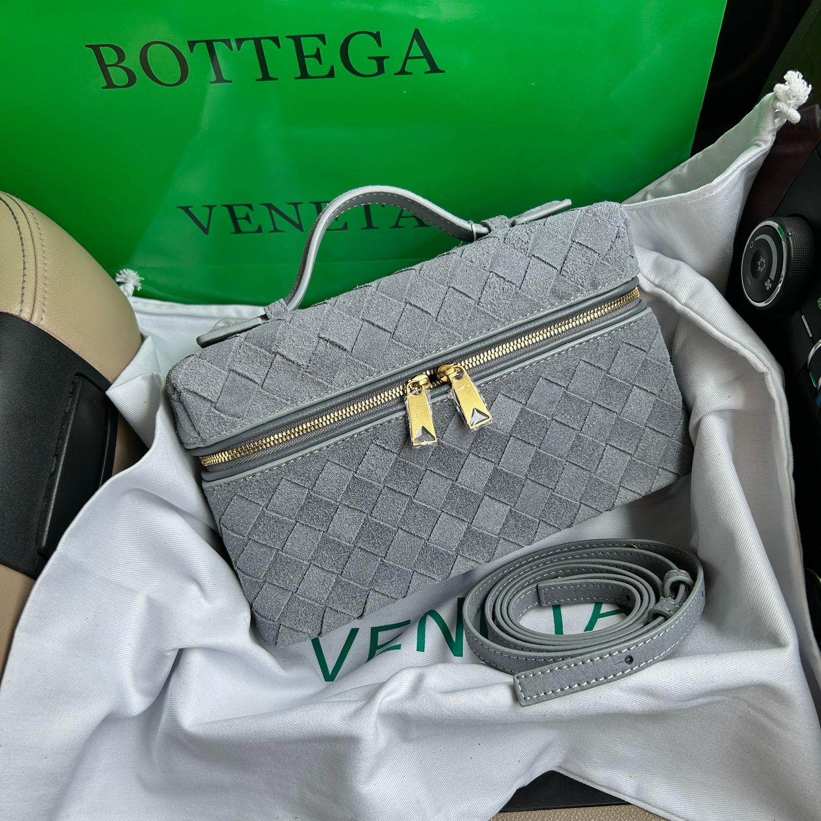 Bottega Veneta Bang Bang vanity case bag in grey suede with gold-tone hardware. image 1