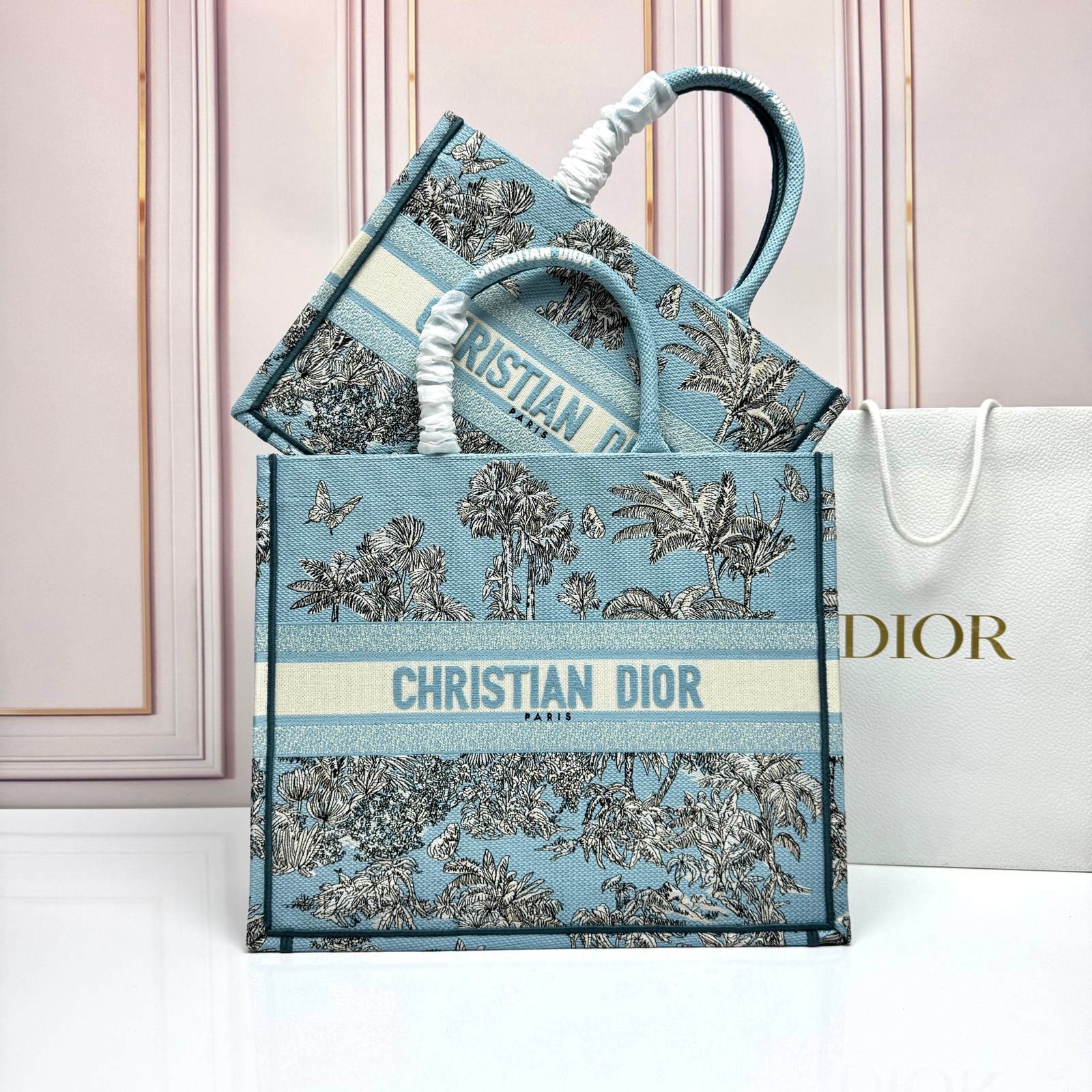 Christian Dior Medium Book Tote in blue and ecru Toile de Jouy Reverse embroidery, featuring a jungle scene motif. image 1