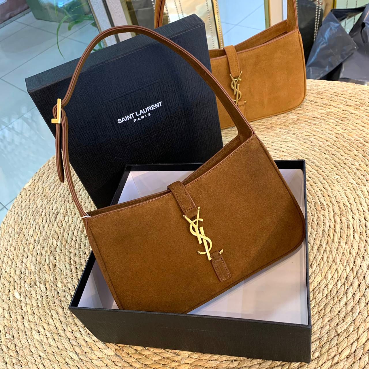 Saint Laurent Le 5 ? 7 Suede Hobo bag in a brown/honey color with gold-tone metal hardware. image 1