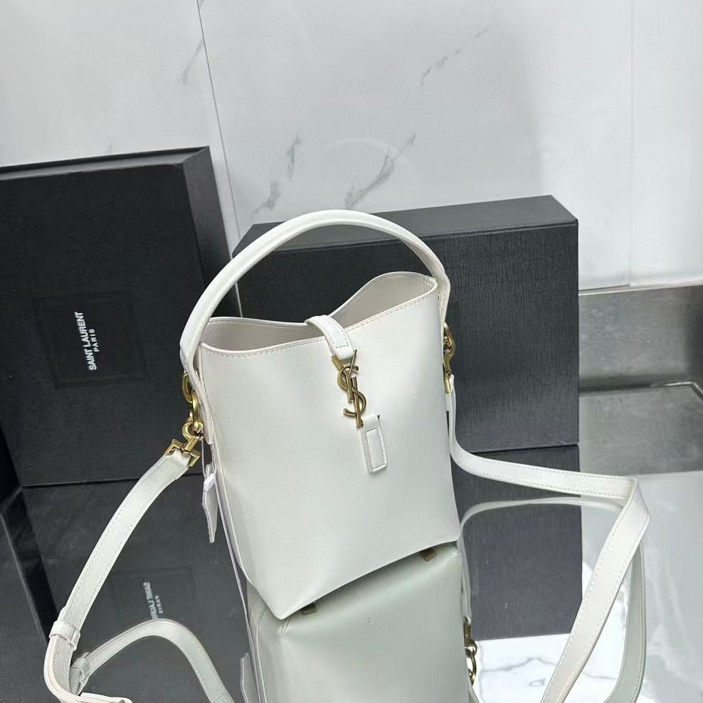 Saint Laurent Le 37 mini bucket bag in white shiny calfskin leather. It features bronze-toned hardware, a Cassandre hook closure, a single top handle, and an adjustable, detachable shoulder strap. image 1