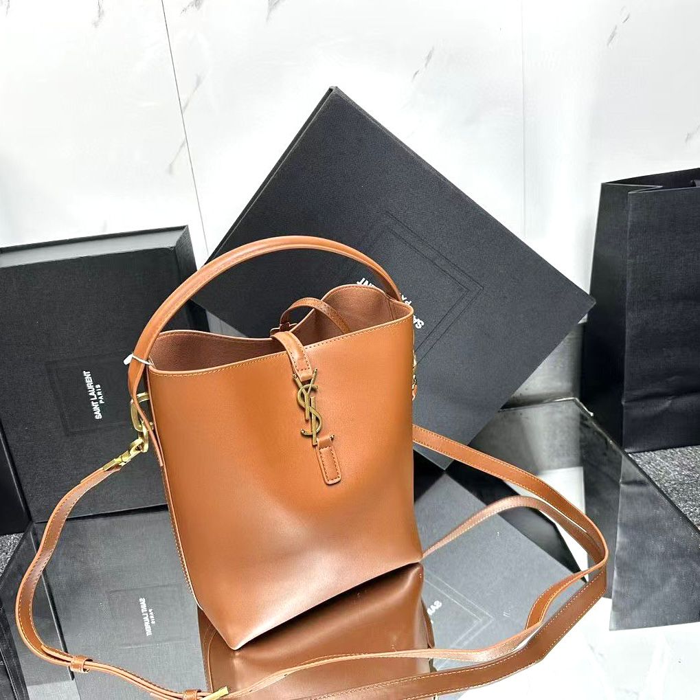 Saint Laurent Le 37 small leather bucket bag in a brown or honey hue. image 1