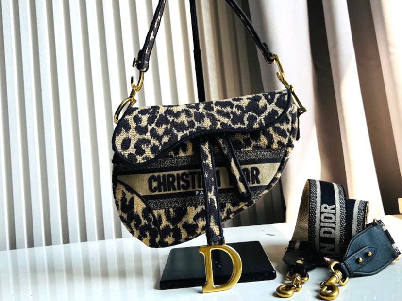 Christian Dior Saddle handbag in beige and black canvas with an all-over leopard print and gilt metal hardware. image 1