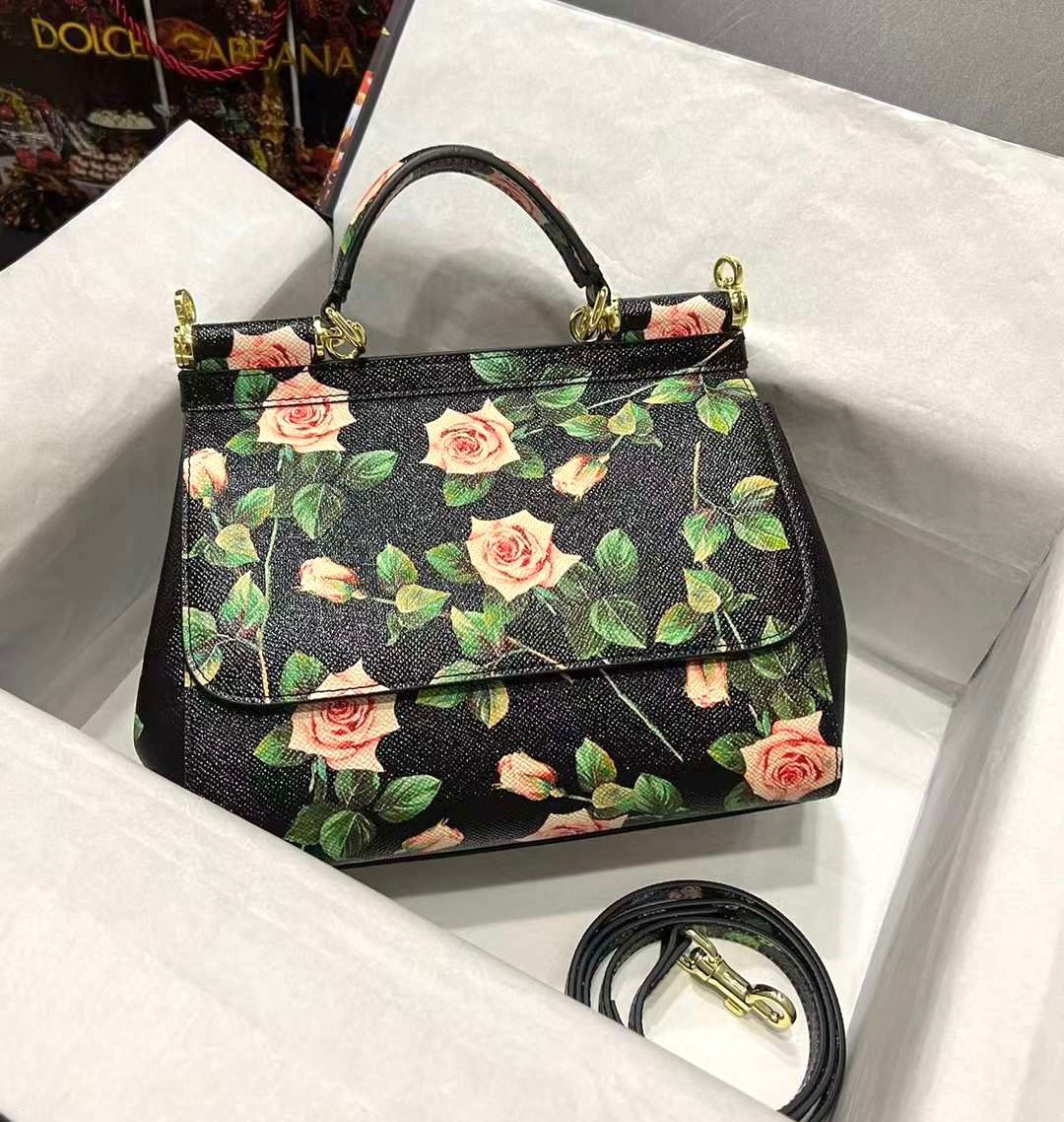 Dolce & Gabbana Miss Sicily top handle bag in black leather with a pink rose floral print. image 1