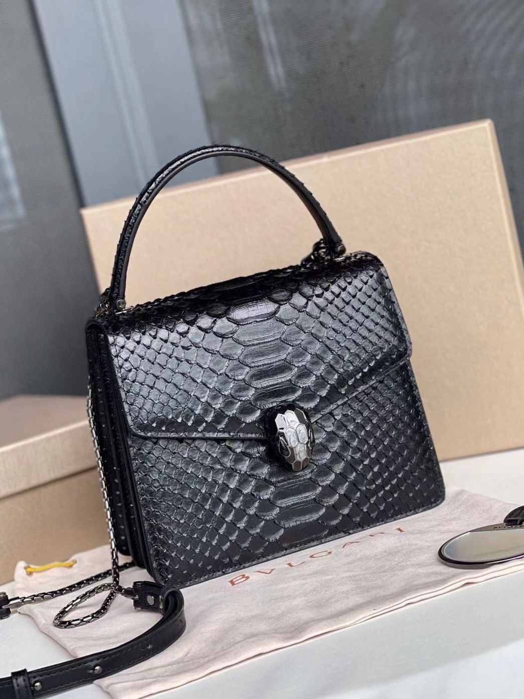 Bvlgari Serpenti Forever mini top handle bag in black python skin leather. image 1