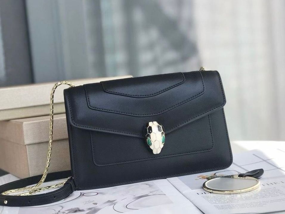 Bvlgari Serpenti Forever East-West or Day-to-Night small shoulder bag in black calf leather with a light gold-plated bronze snake head closure. image 1