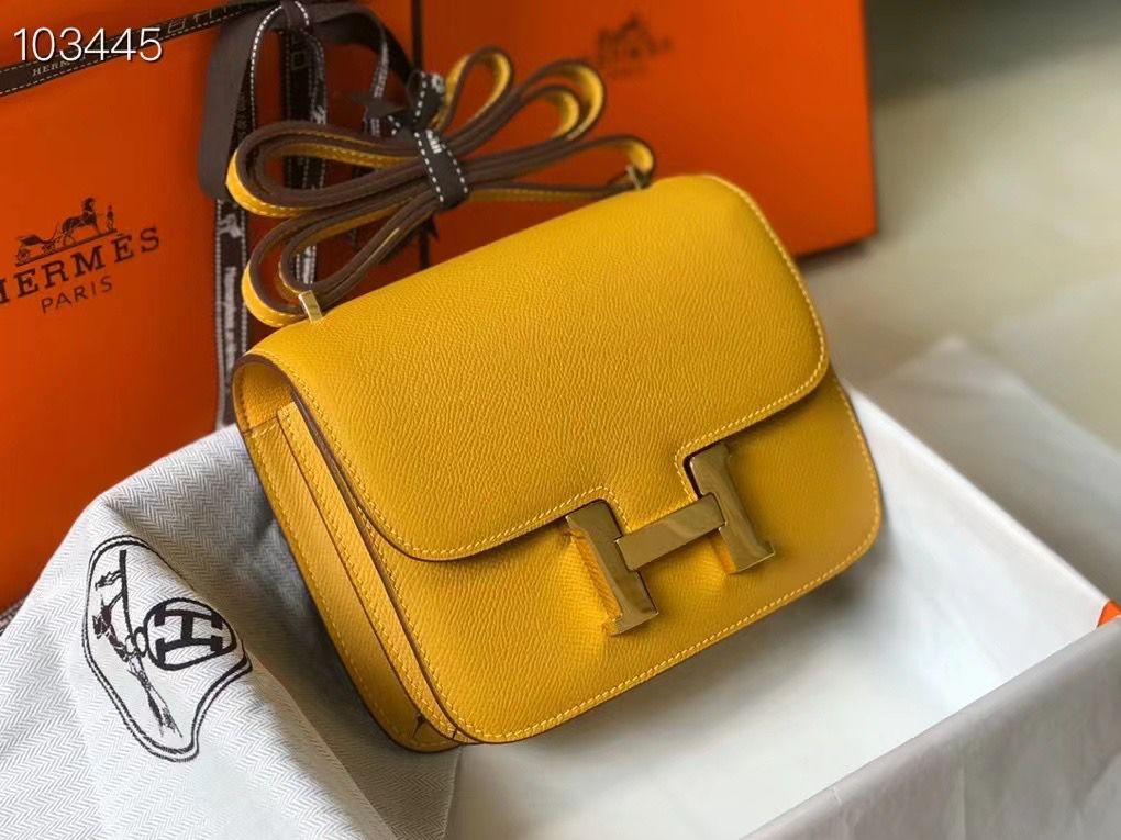 Herm?s Constance 18 bag in a bright yellow (potentially Soufre or Jaune Ambre) Epsom leather with gold-tone hardware. image 1