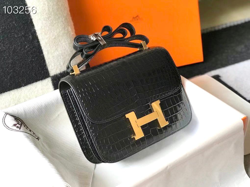 Herm?s Constance 18 bag in black shiny alligator or crocodile leather with gold-finish hardware. image 1