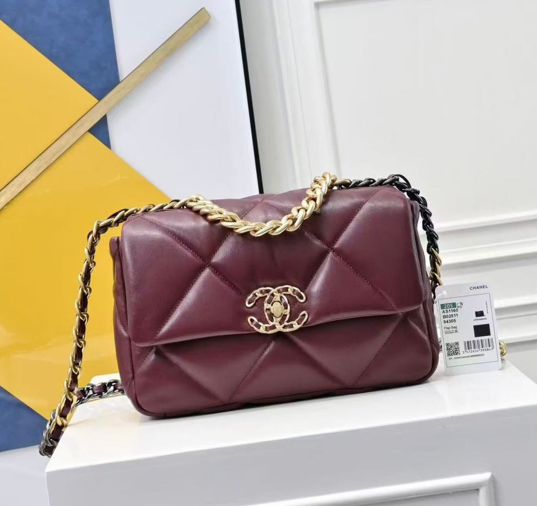 Chanel 19 Flap Bag in burgundy shiny lambskin with gold-tone, silver-tone, and ruthenium-finish metal hardware. image 1