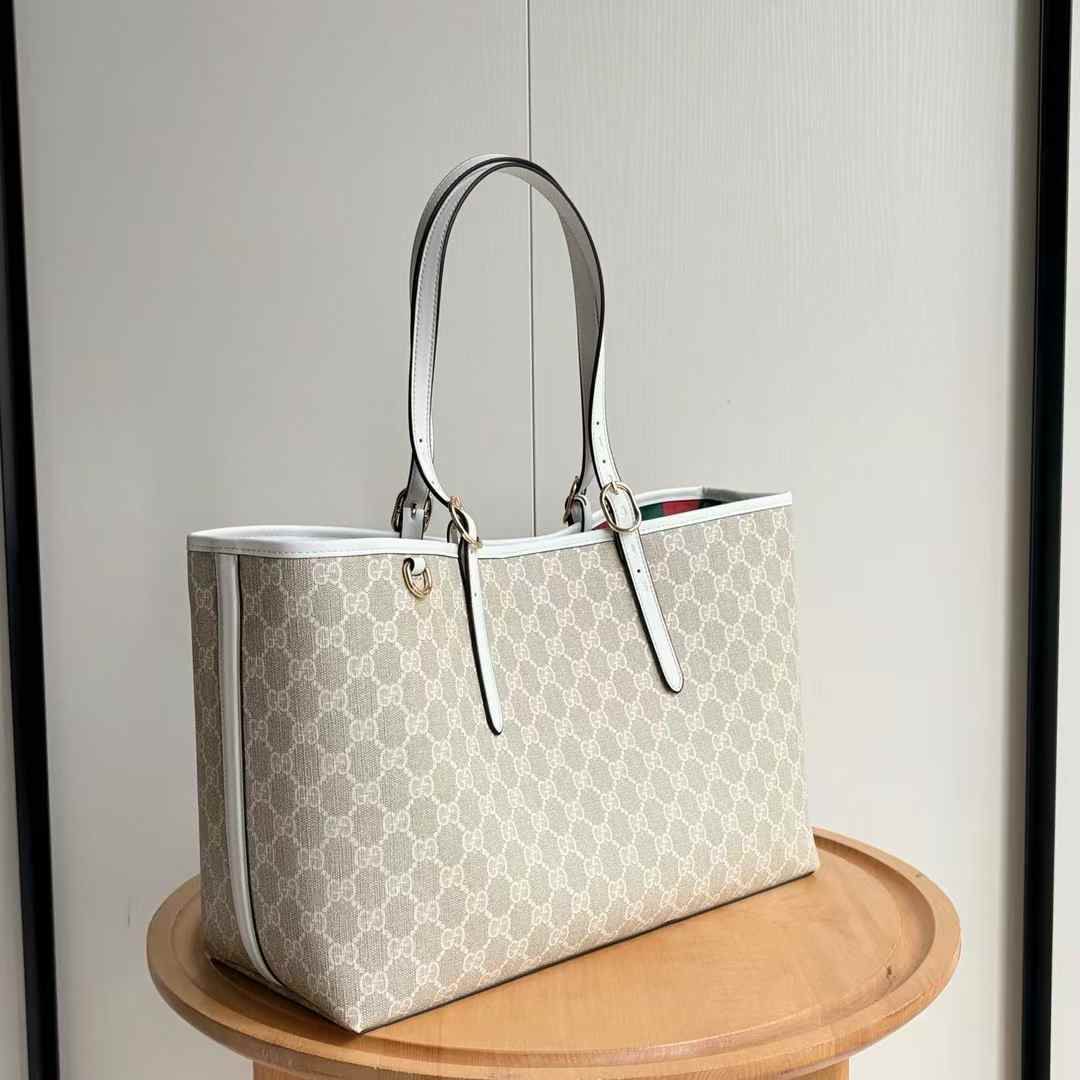 Gucci GG Emblem tote bag in beige and white coated canvas with white leather trim. image 1