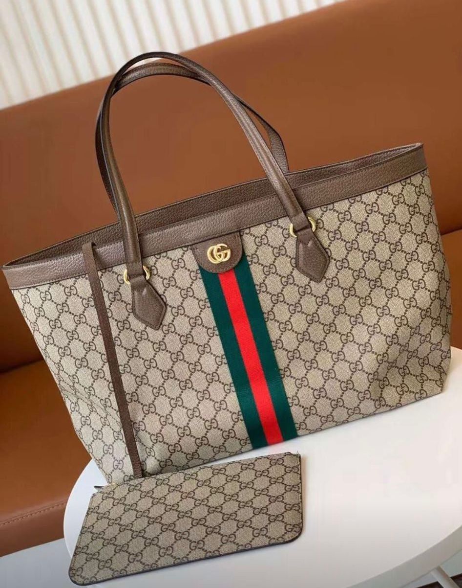 Gucci Ophidia medium tote bag in GG Supreme canvas with brown leather trim and the signature Web stripe. image 1