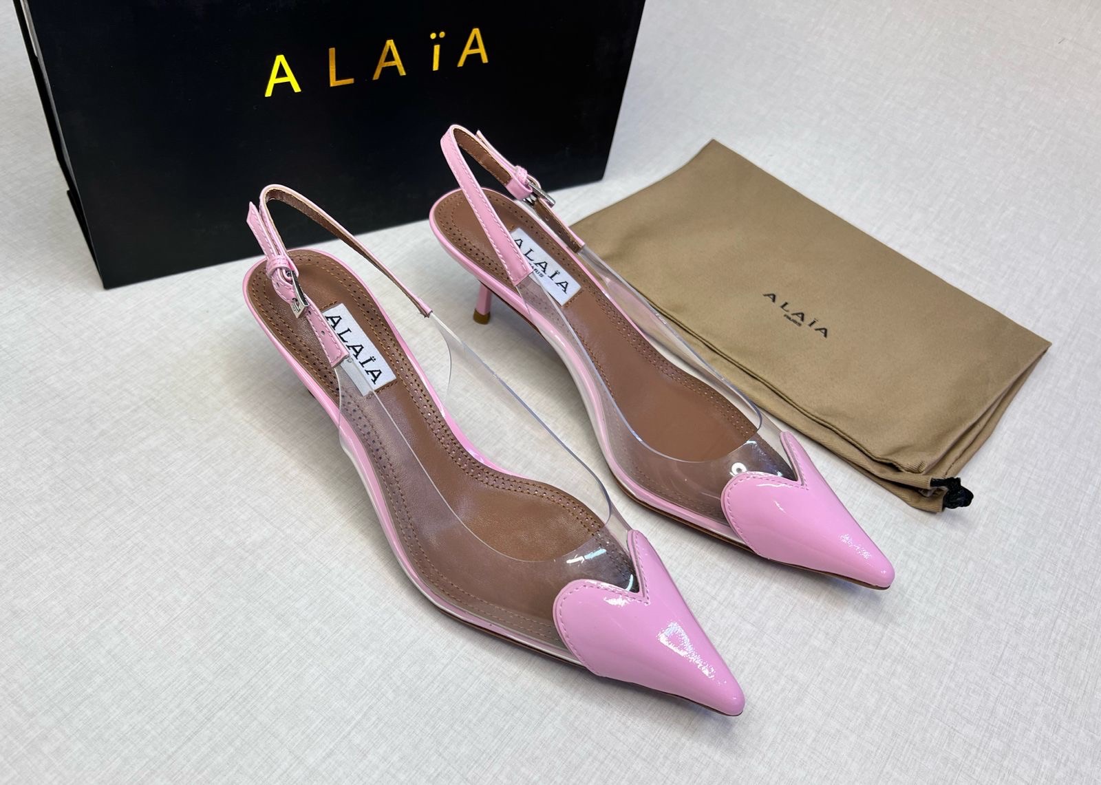 Alaïa Le Cœur patent-leather and PVC slingback pump in pink. image 1