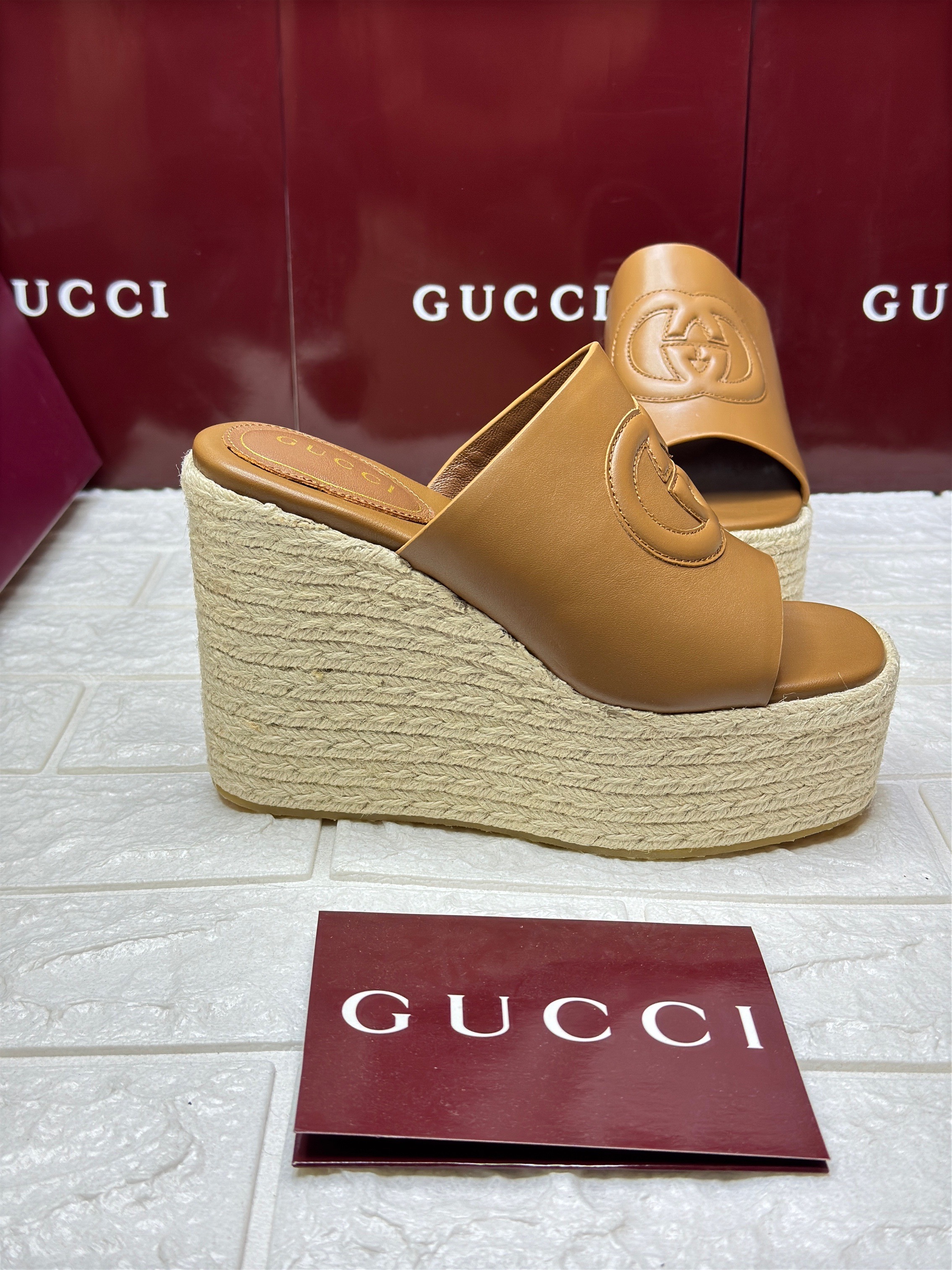 Gucci Interlocking G leather espadrille wedge sandals in a brown or camel color. image 1