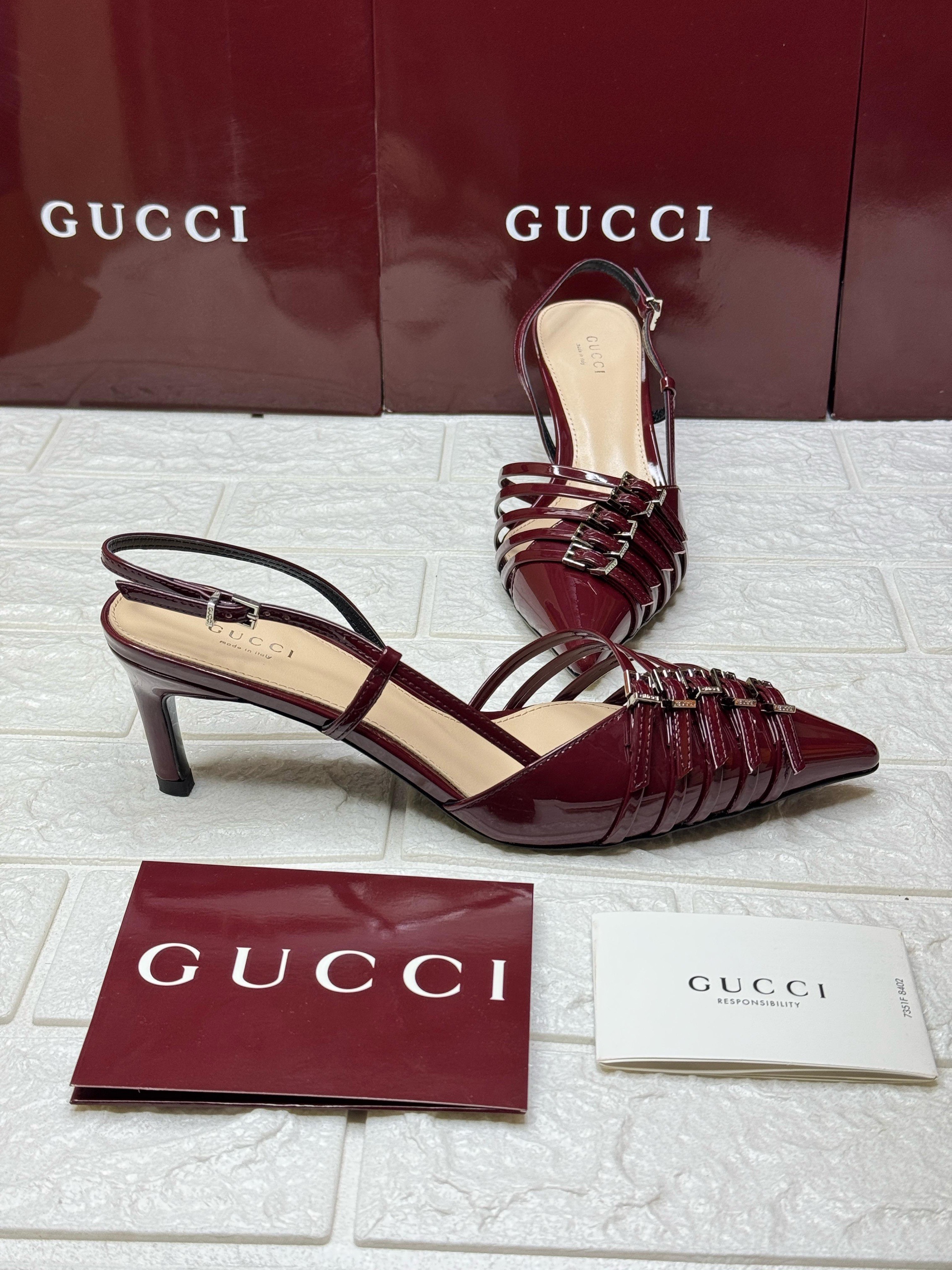 Gucci buckle-detailed leather slingback pumps in a burgundy color. image 1