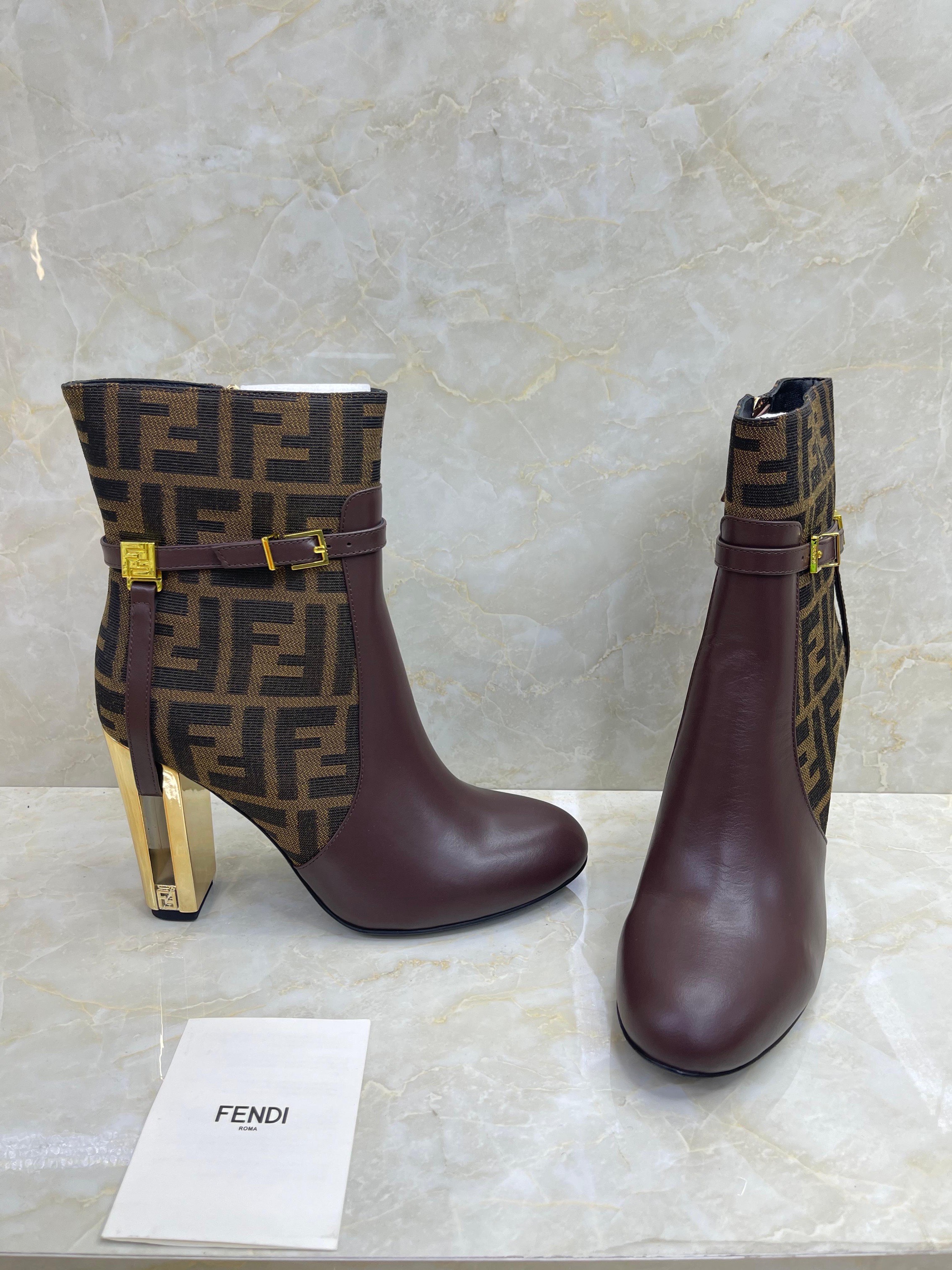 Fendi Delfina brown leather ankle boots with a signature FF motif and gold-tone heels. image 1