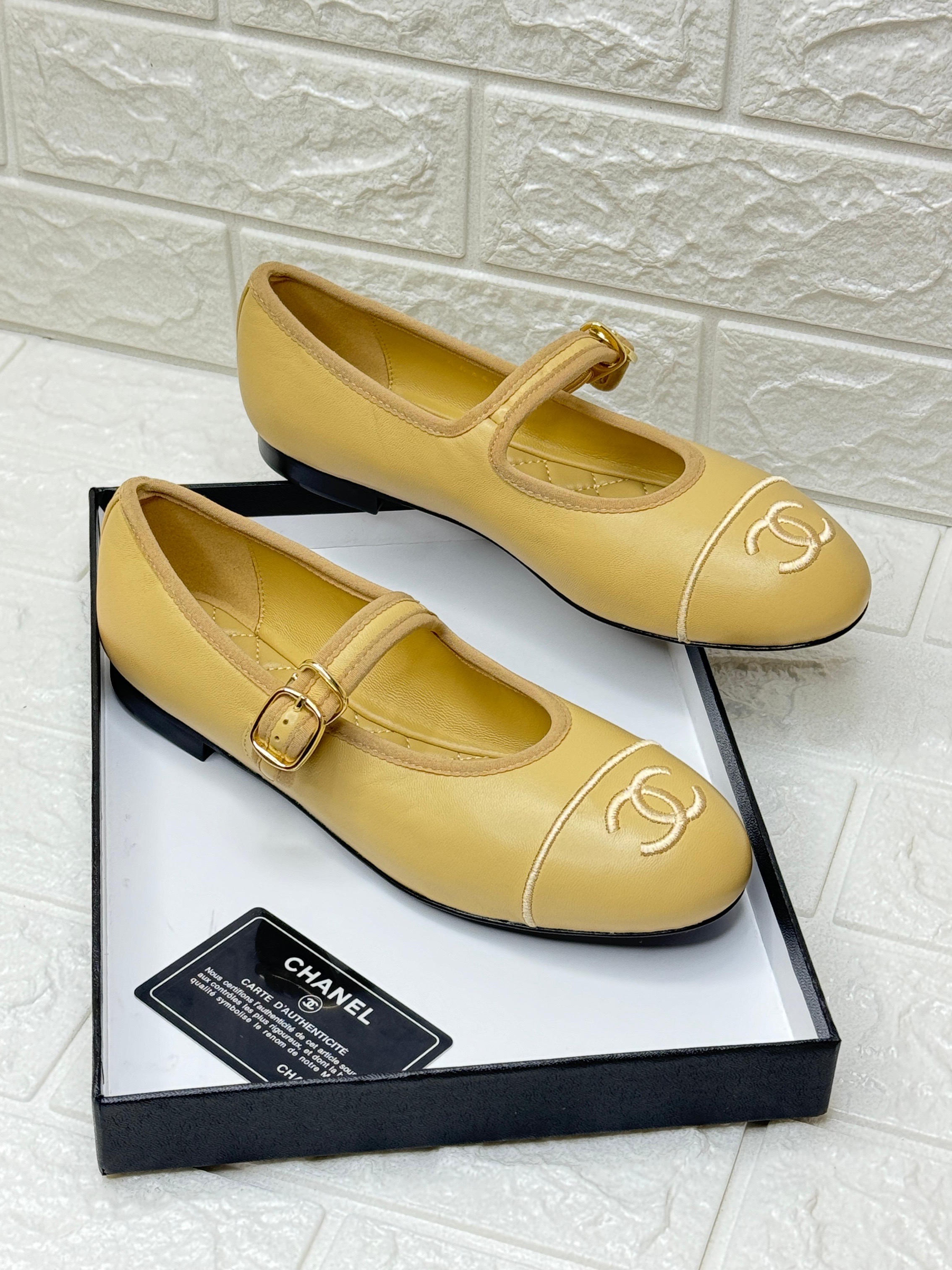 Chanel-style Mary Jane flat shoes with a white CC logo and a buckle strap closure. image 1