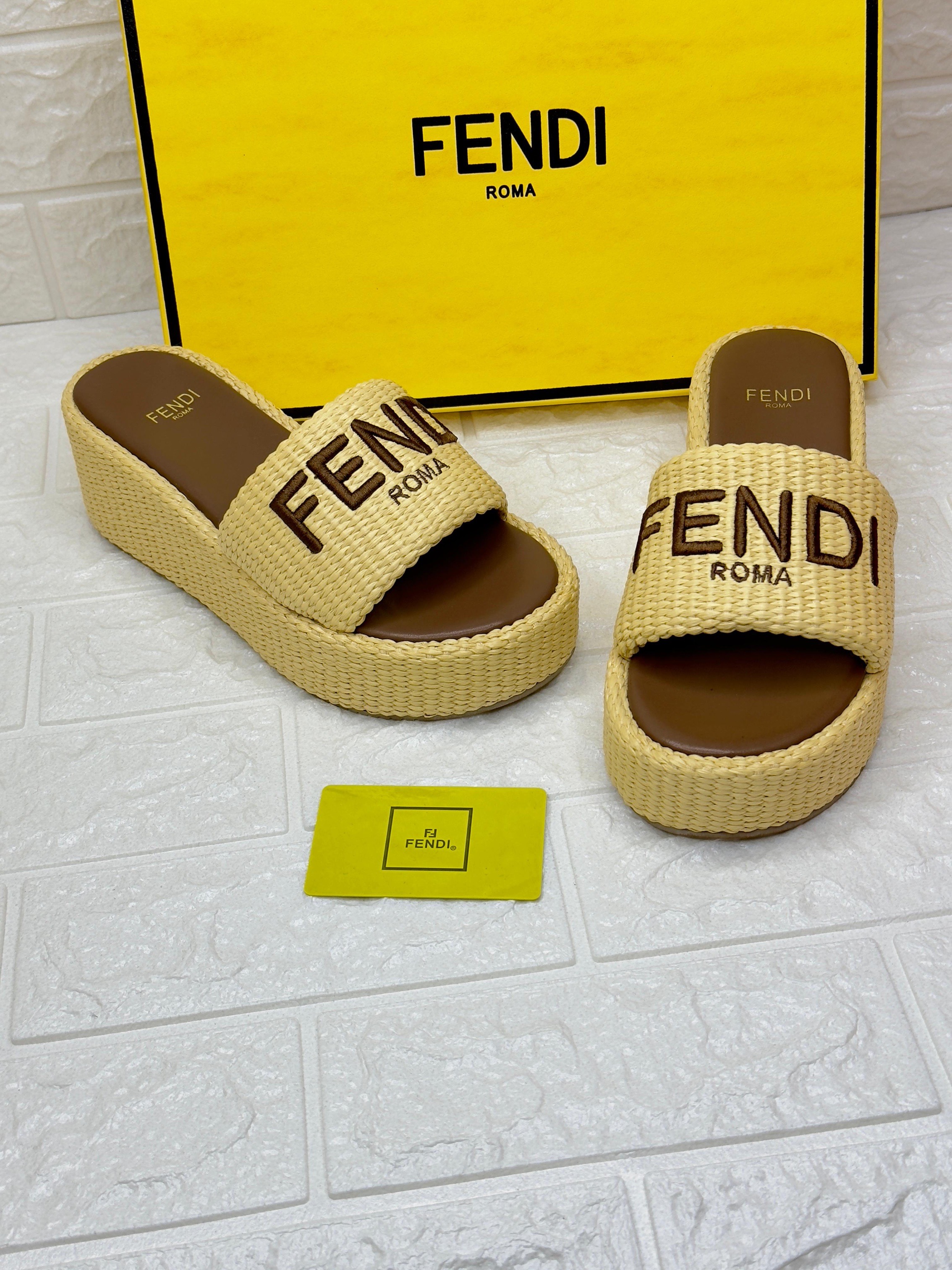 Fendi Signature slides featuring a woven raffia and cotton blend material with a platform sole. image 1