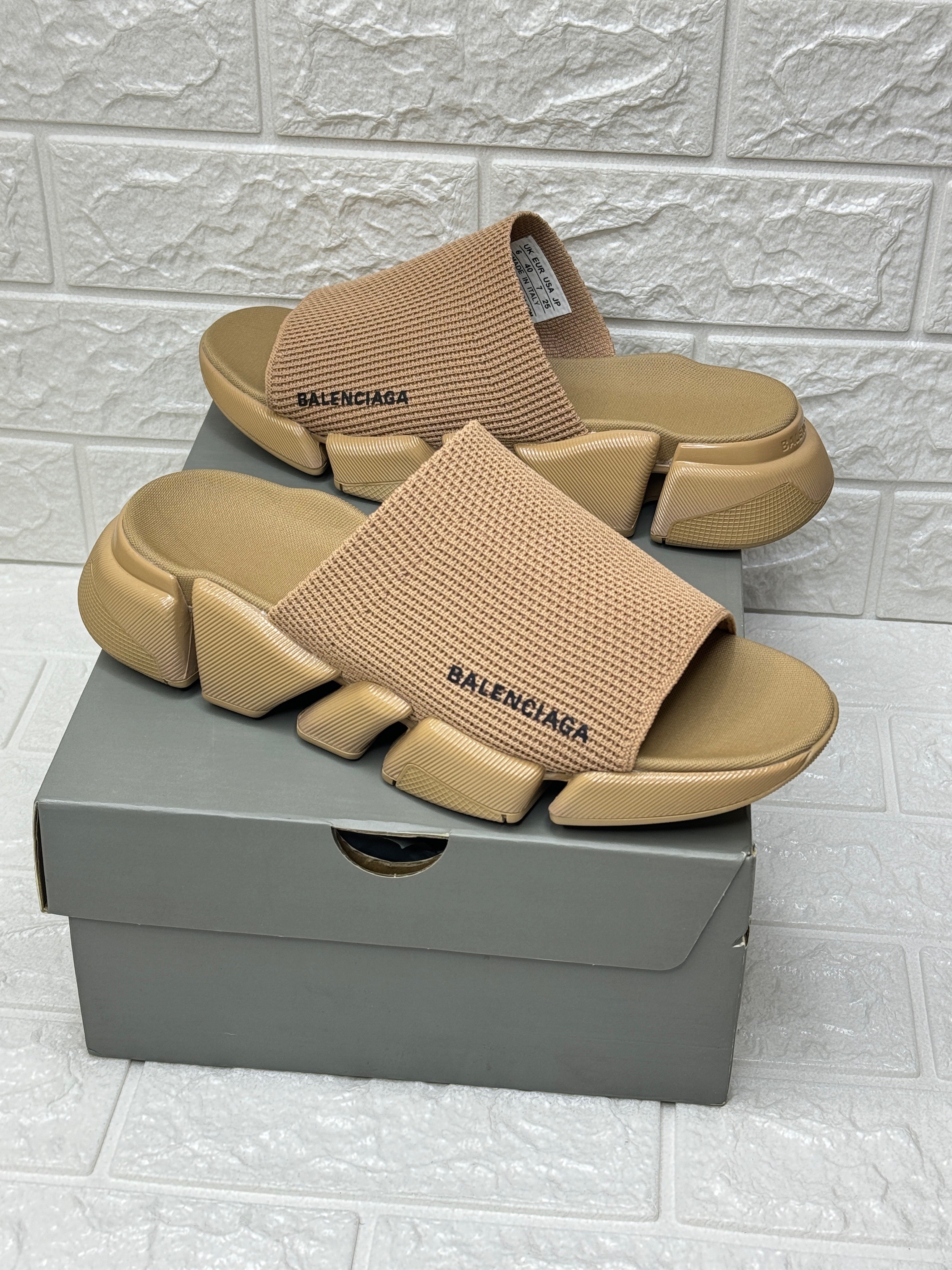 Balenciaga Speed 2.0 recycled knit slide sandals in a beige or light brown color. image 1