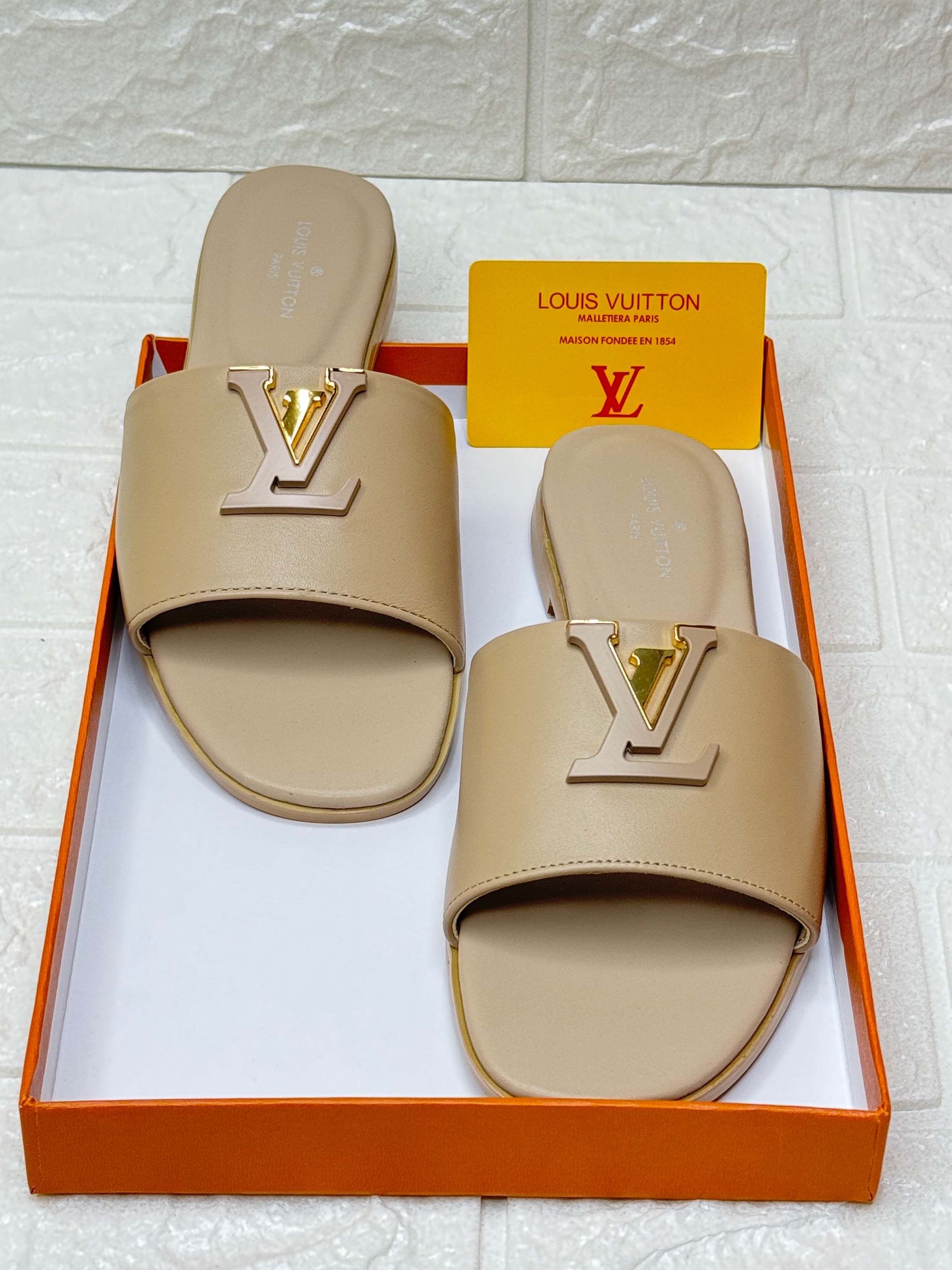 Louis Vuitton Capri flat mules in chocolate calfskin leather. image 1