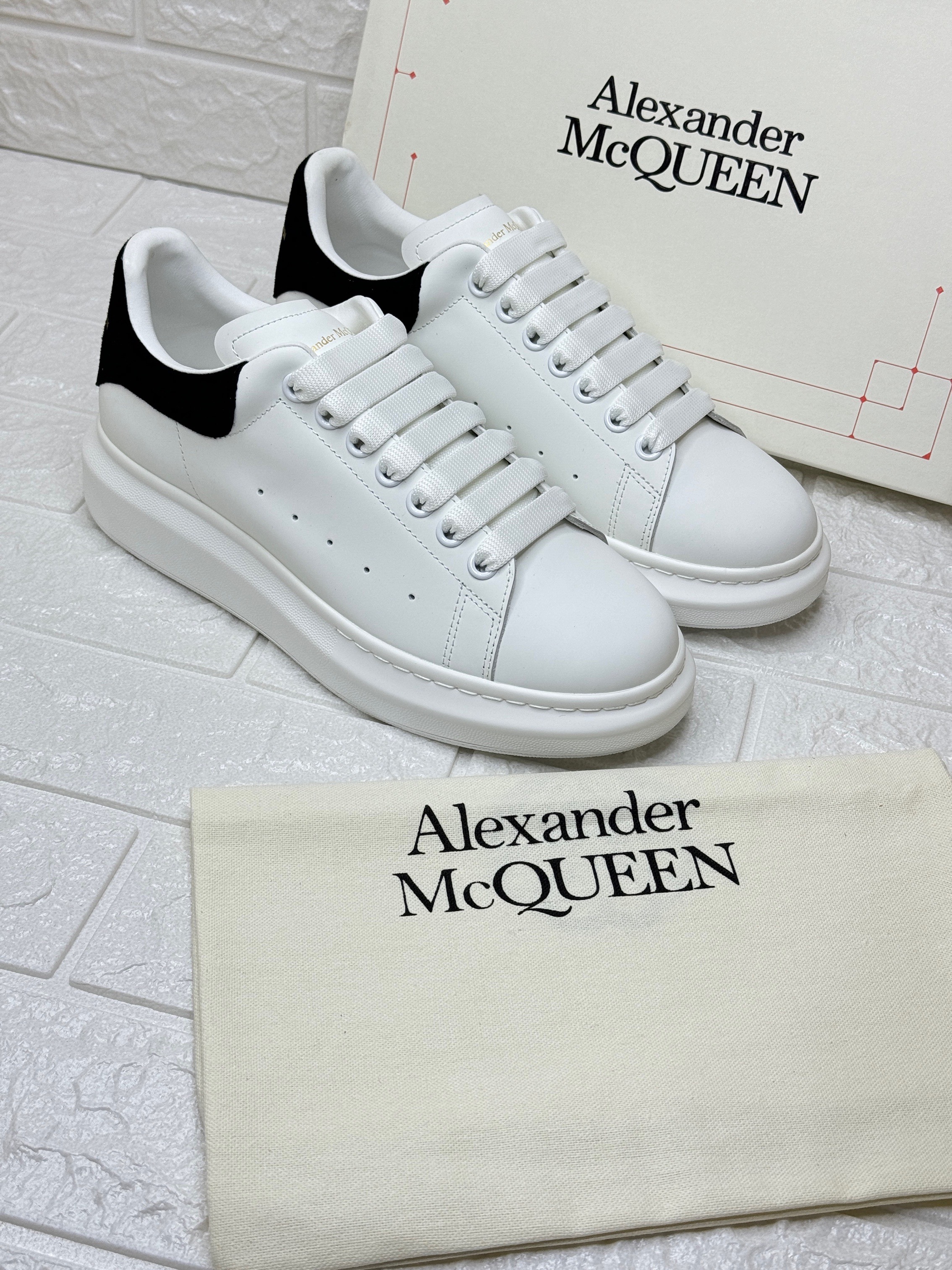 Alexander McQueen Oversized Sneaker in white smooth calf leather with black back details. image 1