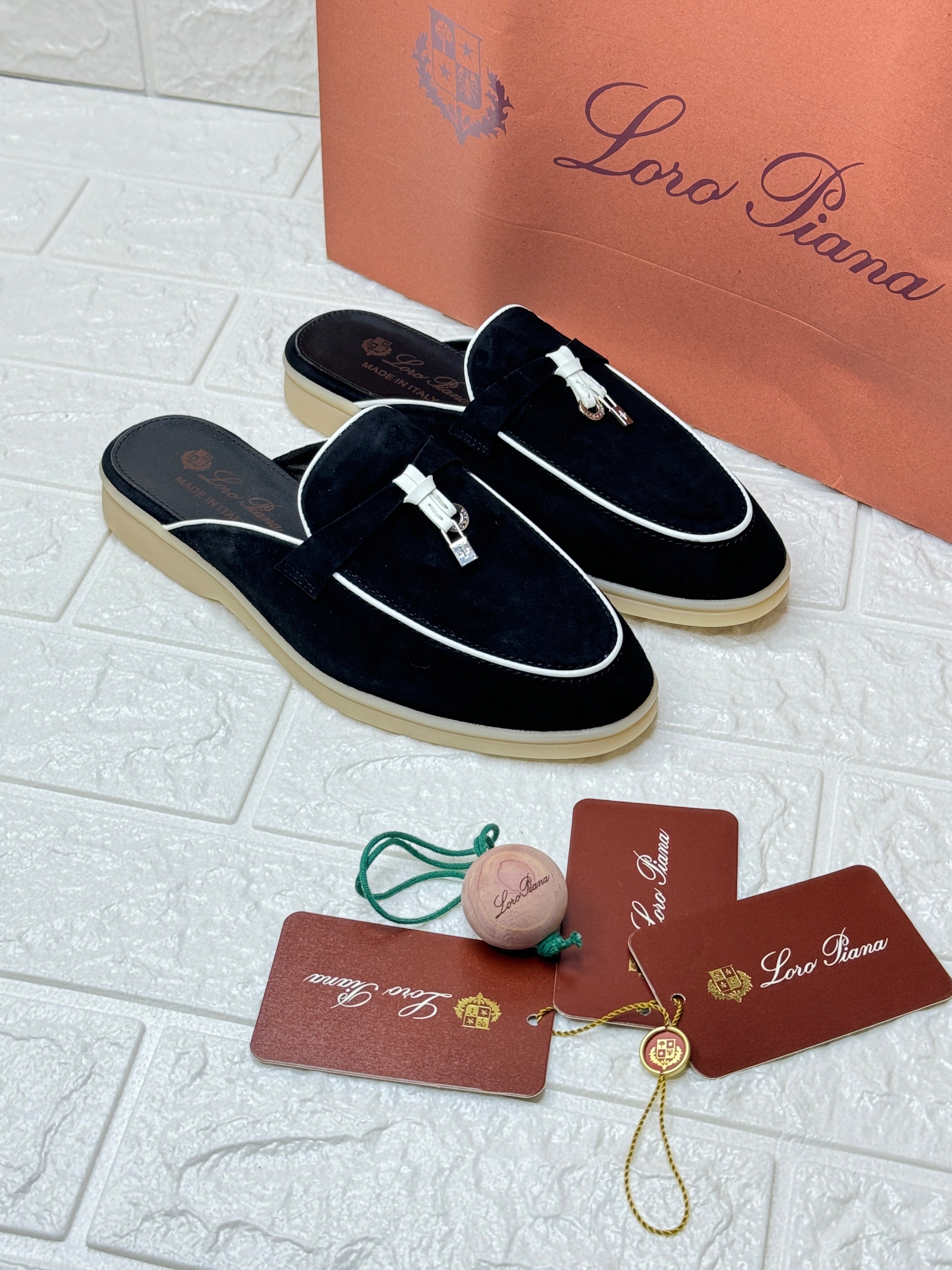 Loro Piana Charms Walk Babouche loafers in black suede with white soles. image 1