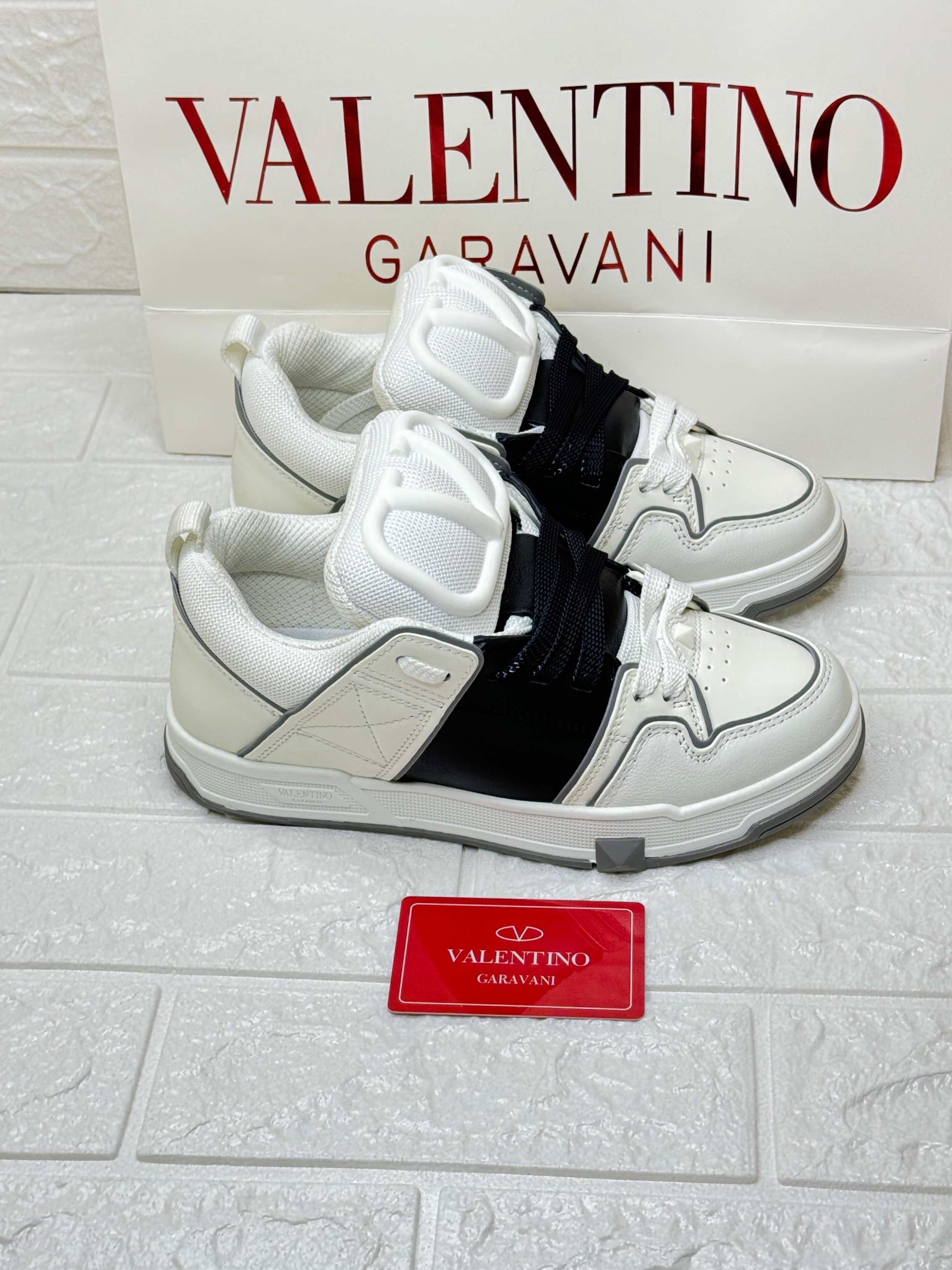Valentino Garavani Open Skate low-top sneaker in white calfskin leather with a black band. image 1