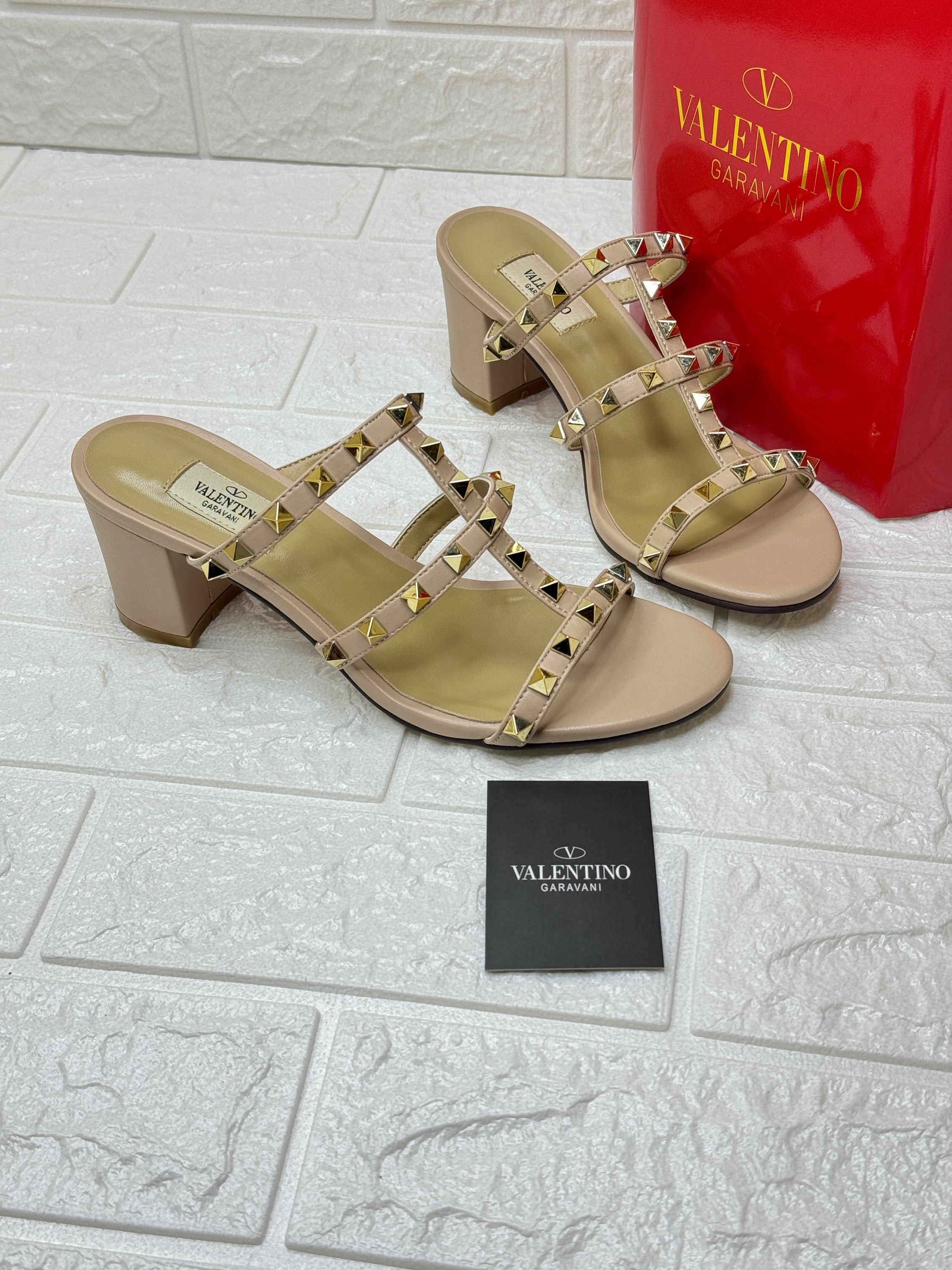 Valentino Garavani 60mm Rockstud sandals in powder pink calf leather with gold-tone Rockstud detailing. image 1