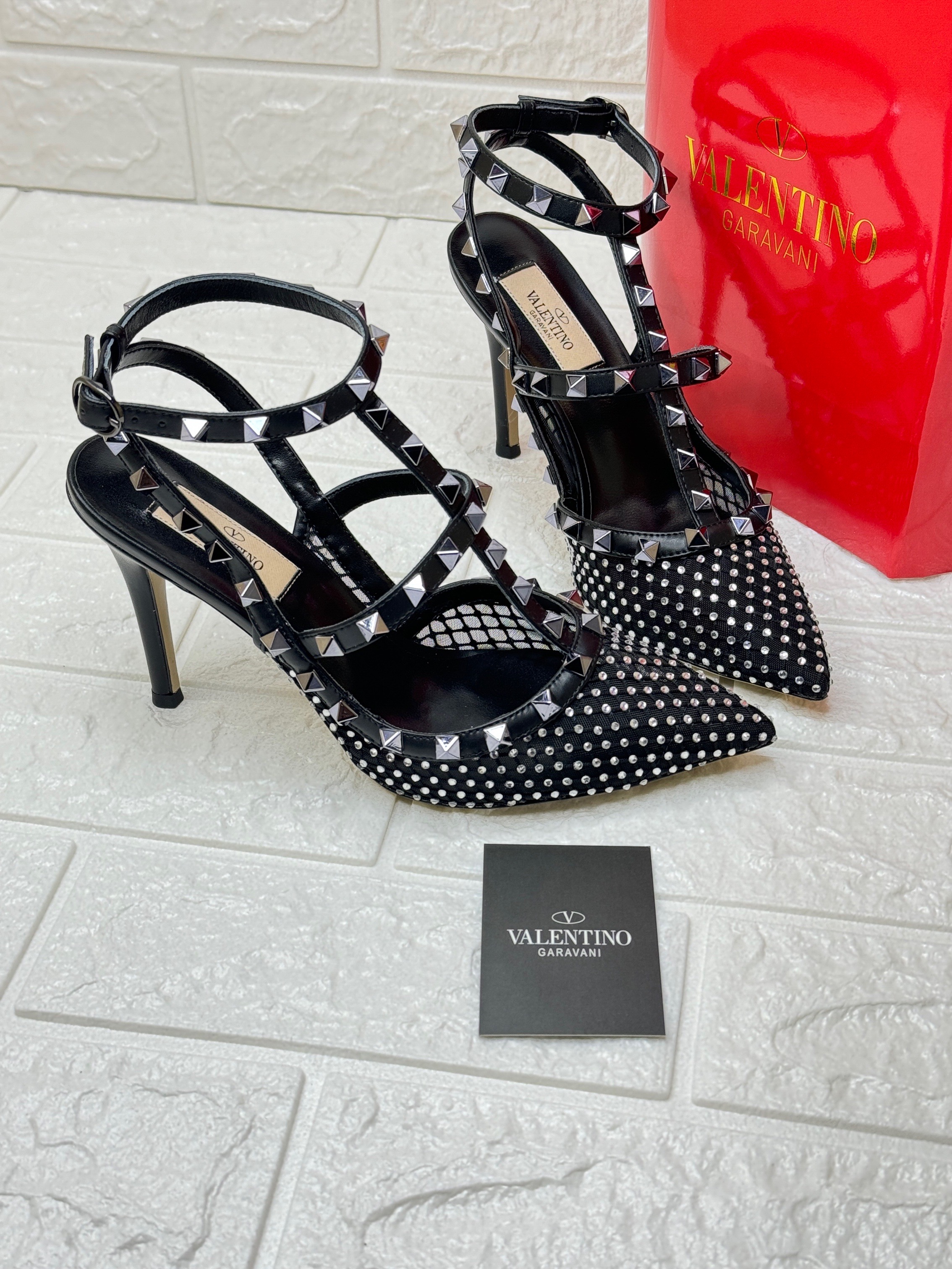 Valentino Garavani Rockstud crystal-embellished leather and mesh pumps in black. image 1