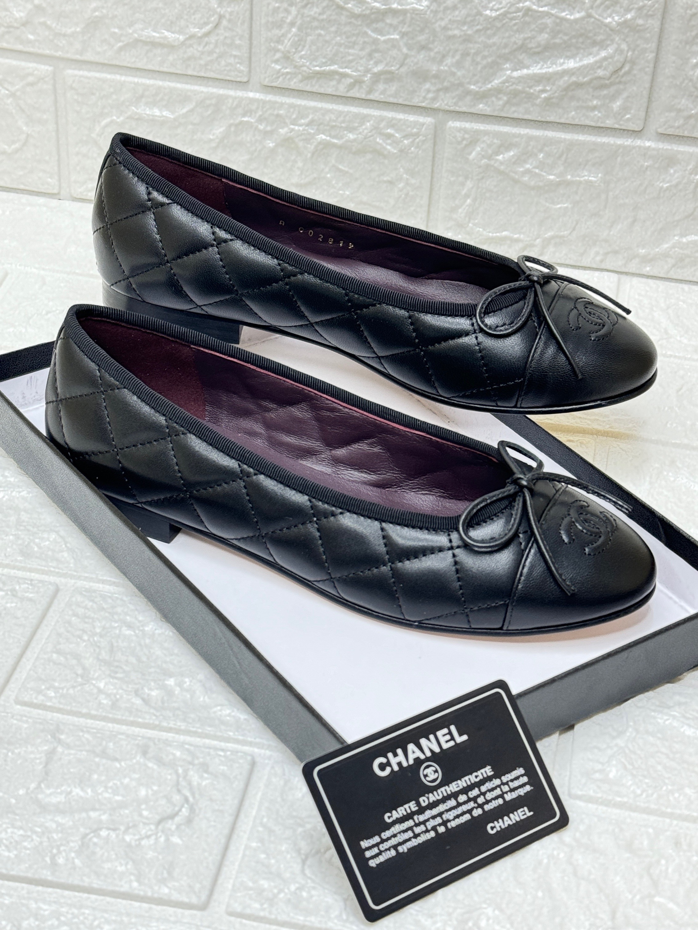 Chanel black quilted leather CC bow cap toe ballet flats. image 1