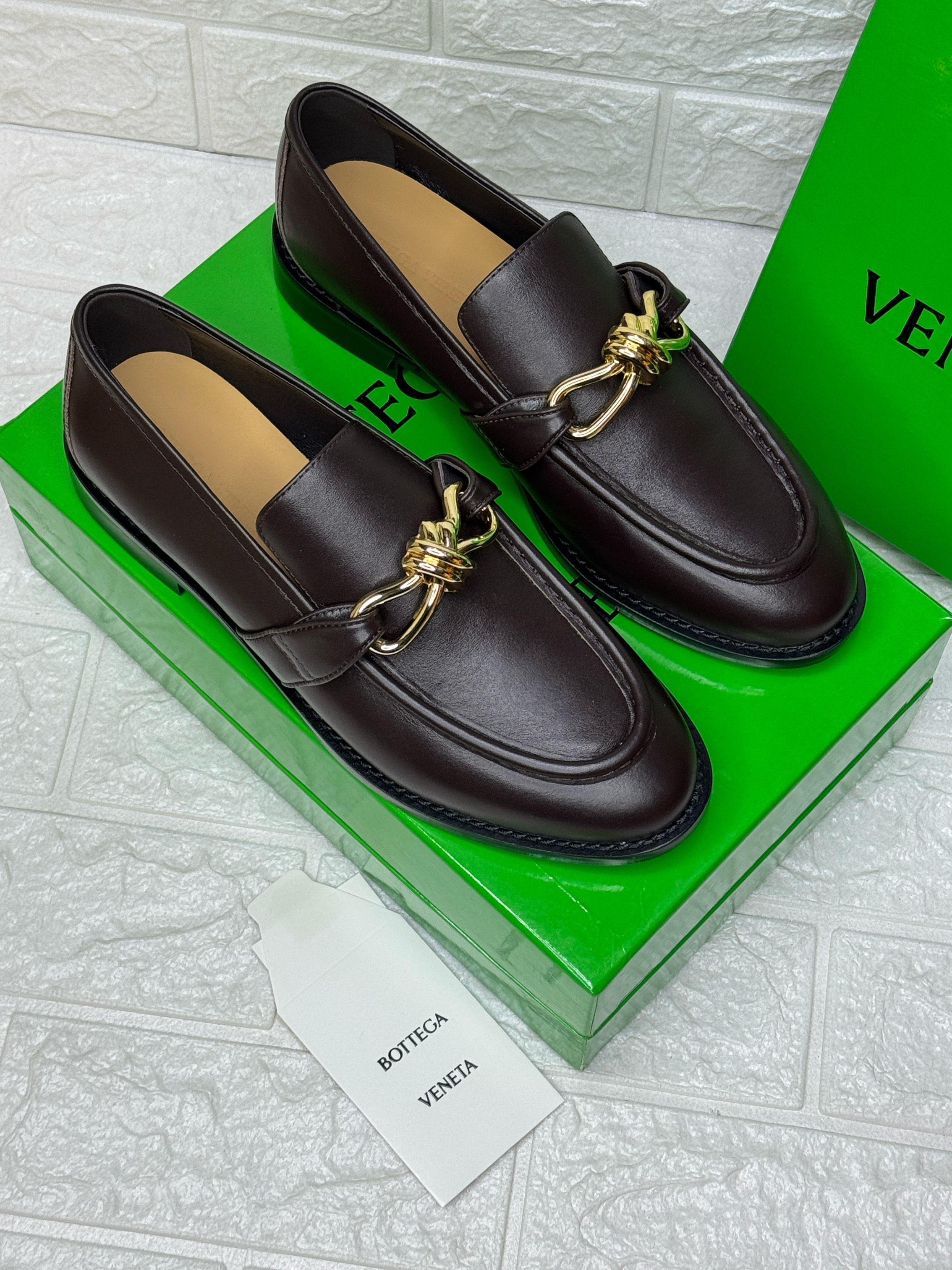Bottega Veneta Astaire loafers featuring gold-tone knot hardware. image 1