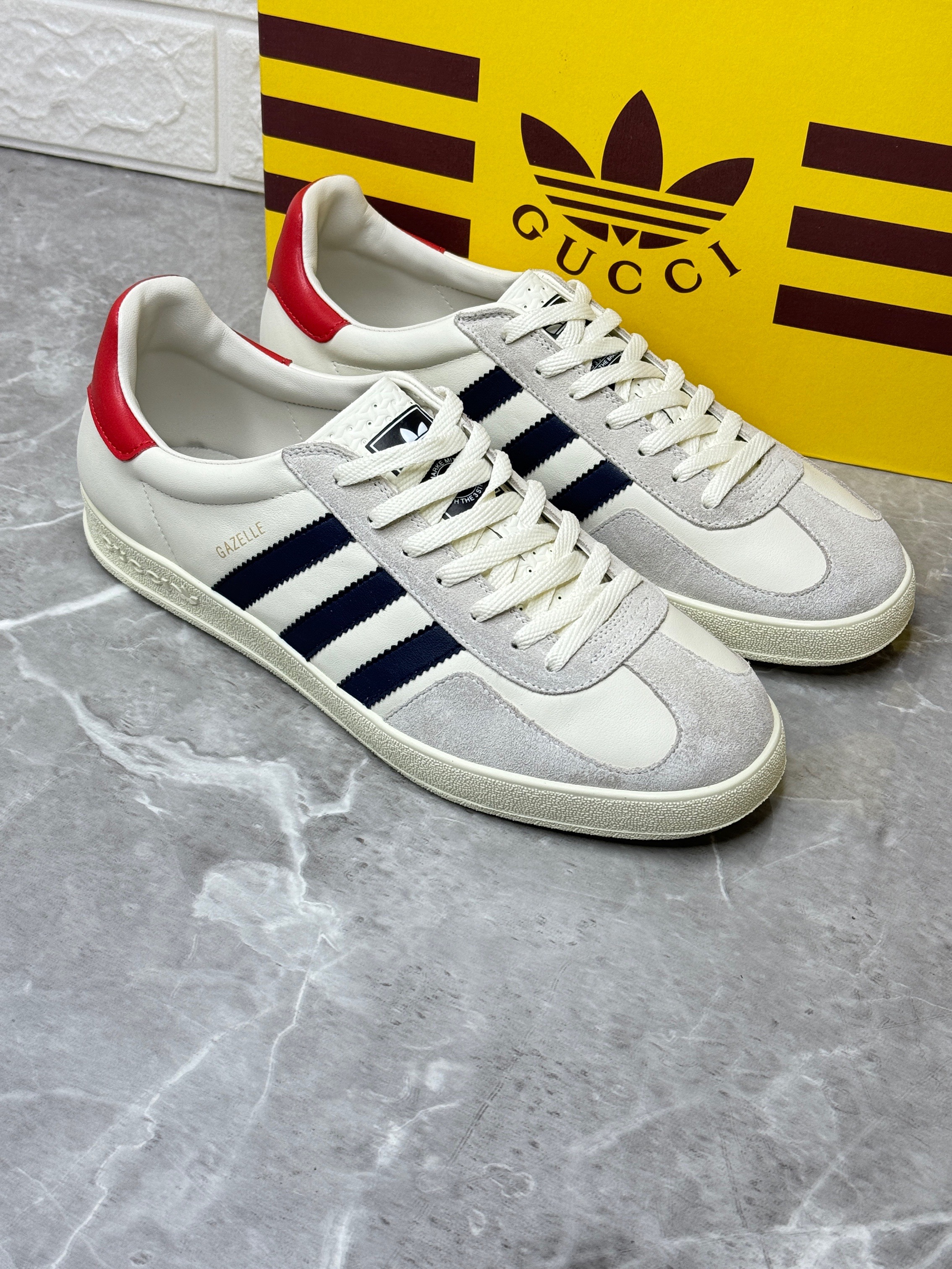 Adidas x Gucci Gazelle sneaker in the white, red, and black colorway. image 1