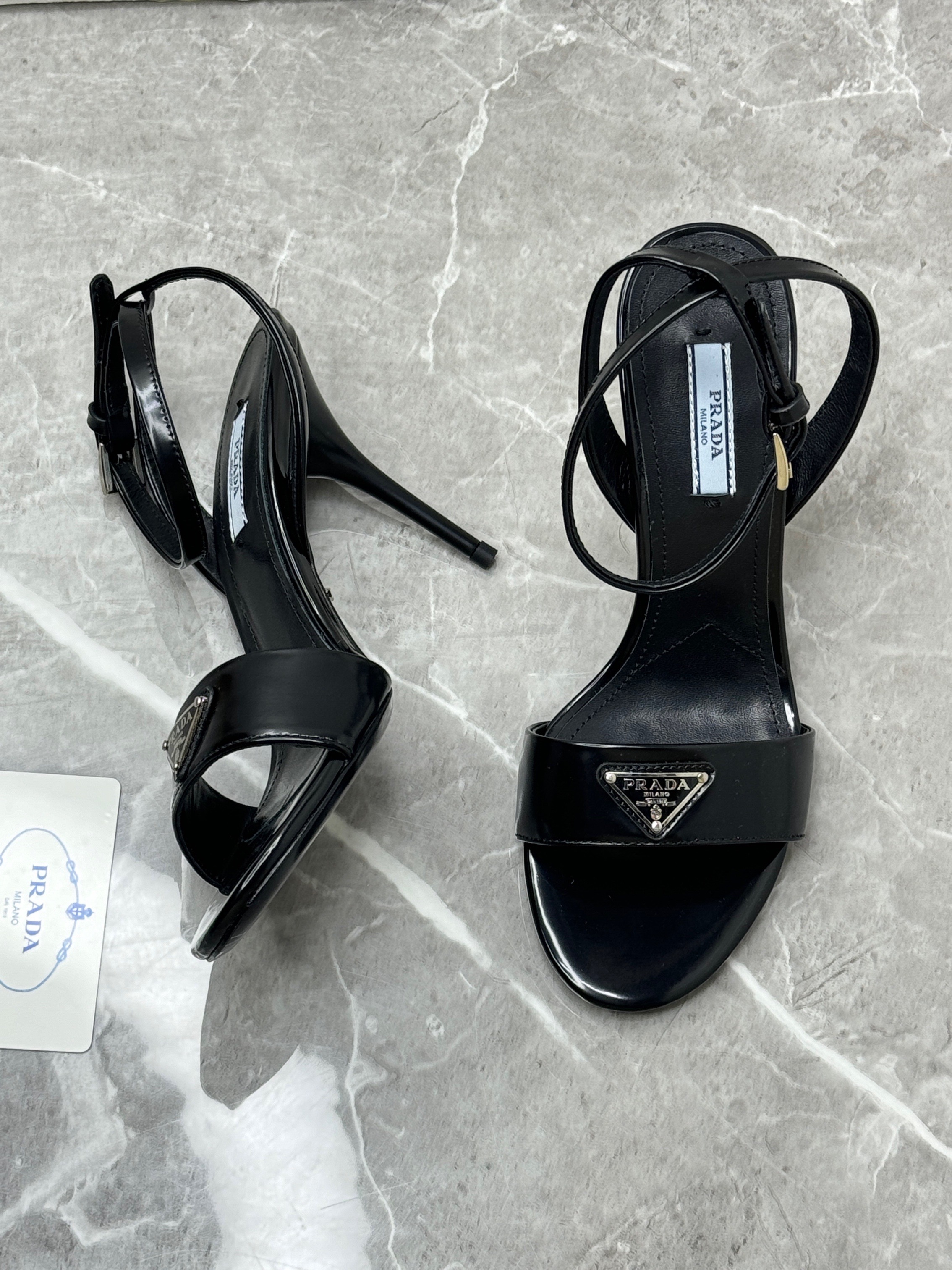 Prada Black Brushed Leather Heeled Sandals with an enameled metal triangle logo. image 1