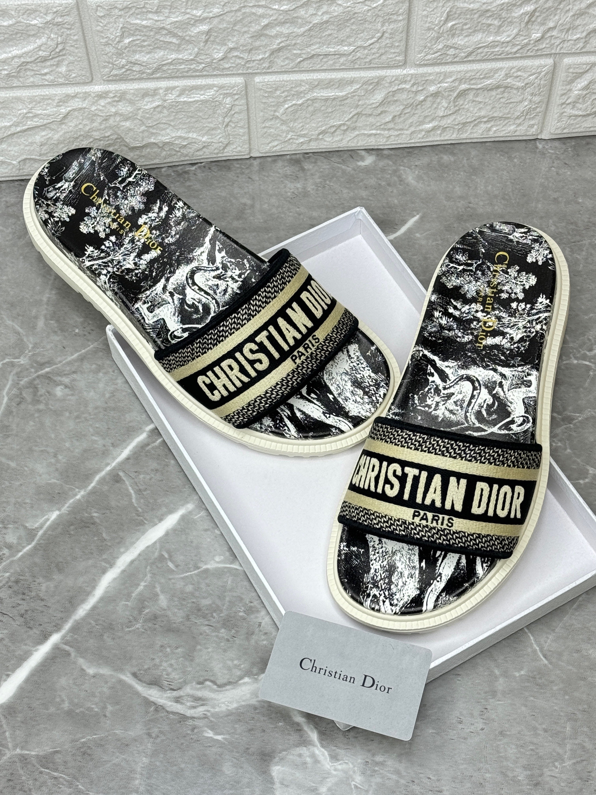 Christian Dior Dway slides with a grey Toile de Jouy motif and the "Christian Dior Paris" signature embroidered on the upper. image 1