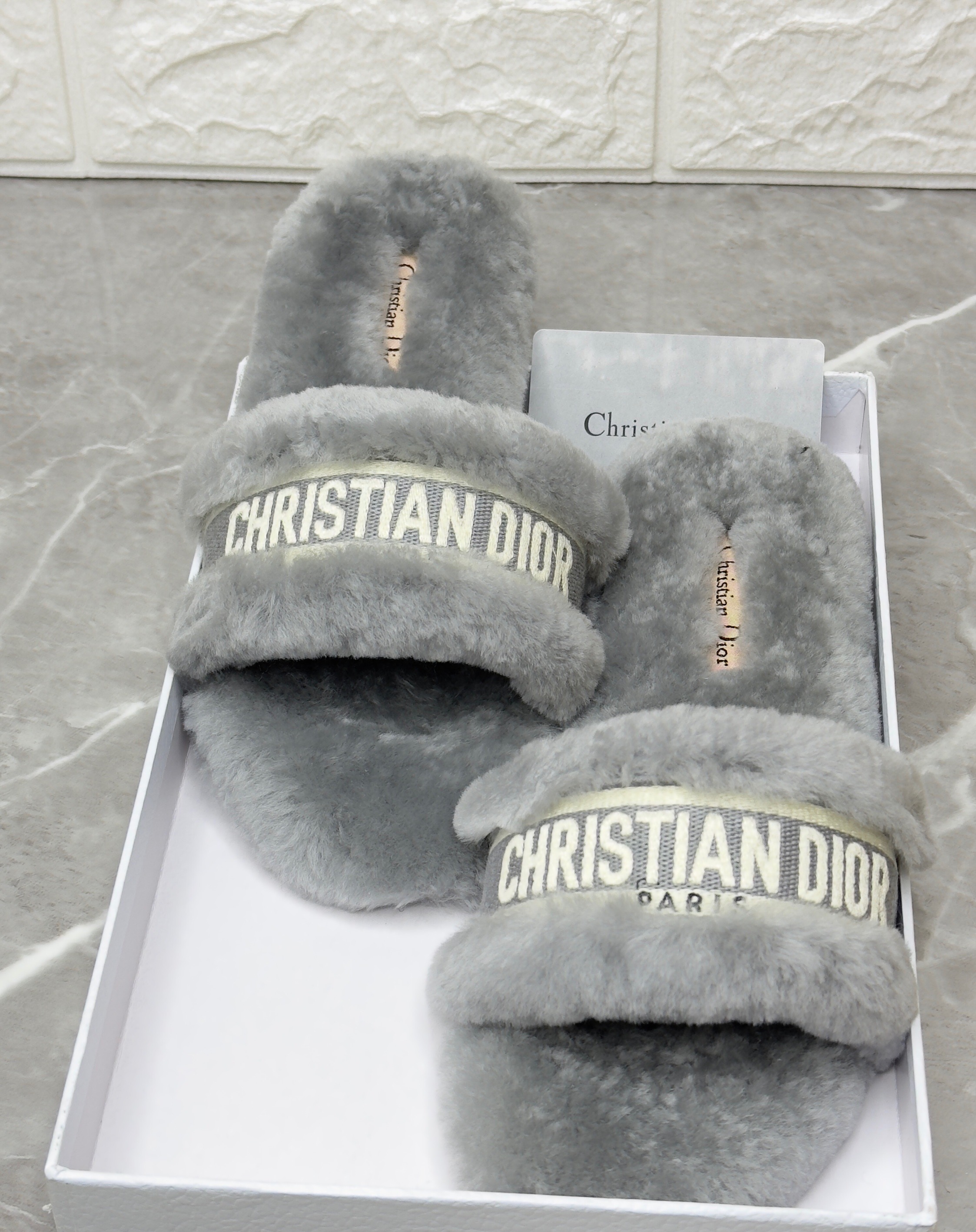 Dior Dway shearling flat slides in grey. image 1