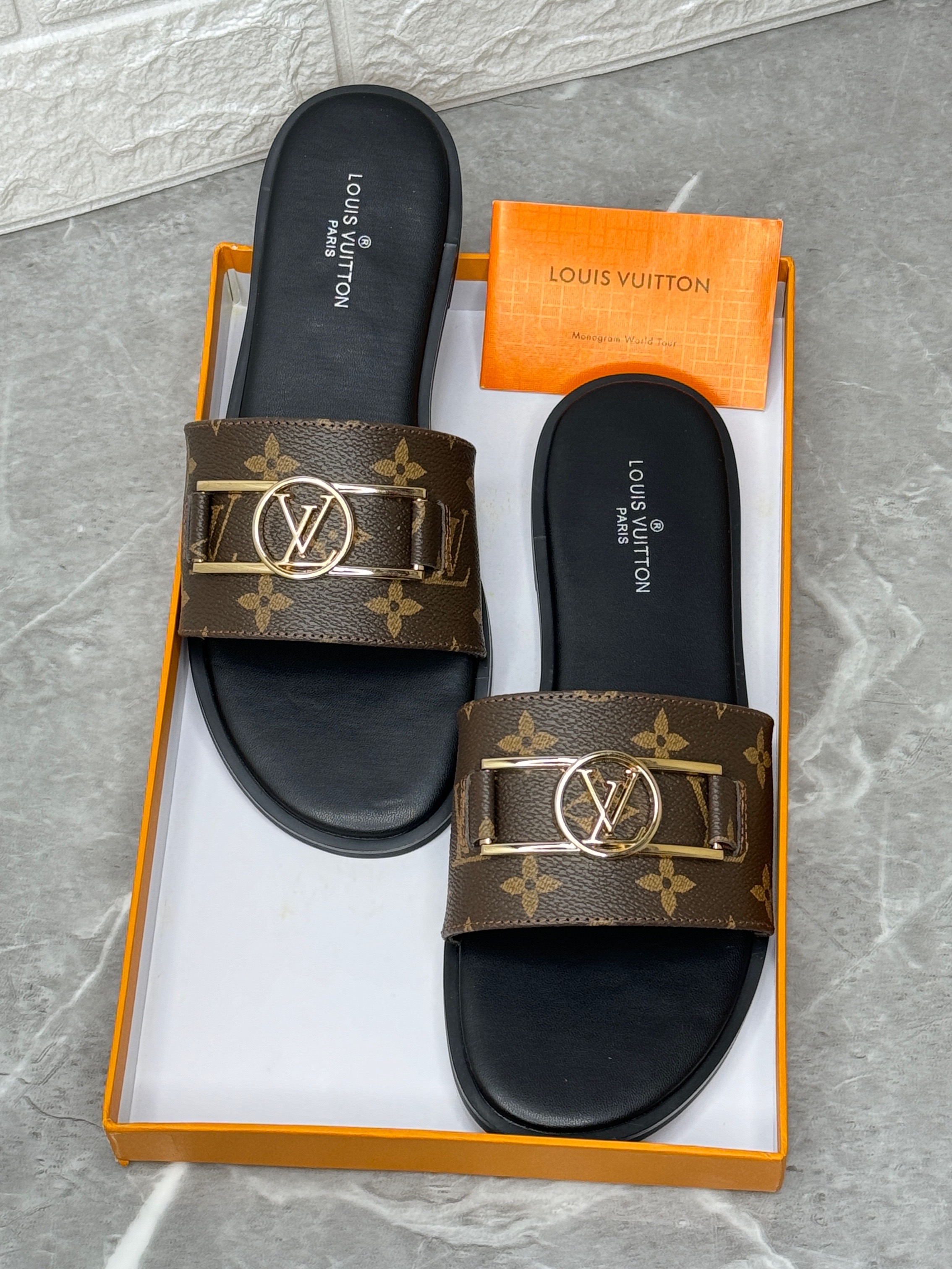 Louis Vuitton Lock It Flat Mules in Monogram canvas. image 1