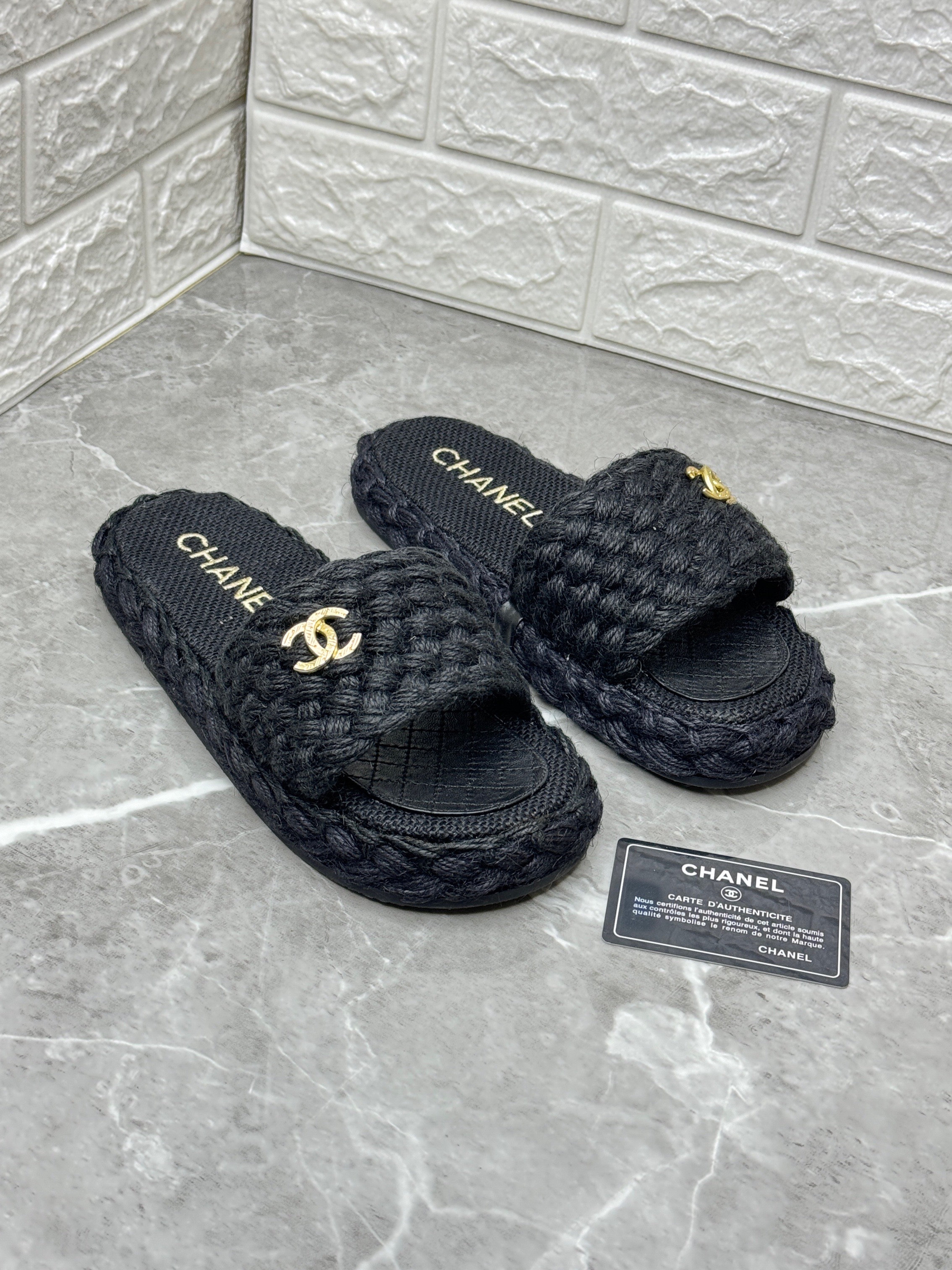 Chanel slides with a rope weave upper and gold-tone chain detailing image 1