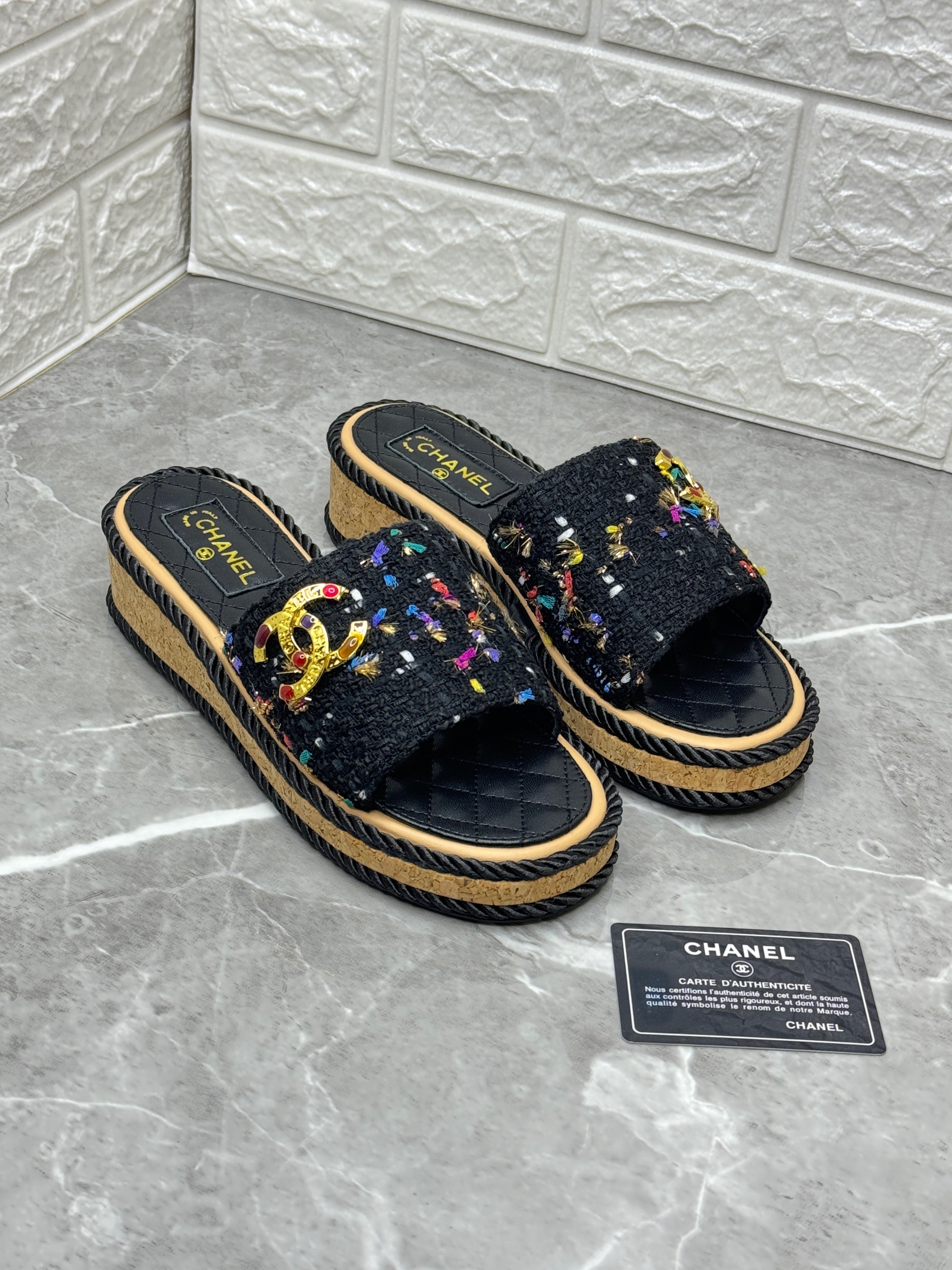 Chanel platform slide sandals in black tweed with multi-color embellishments and a cork wedge sole image 1