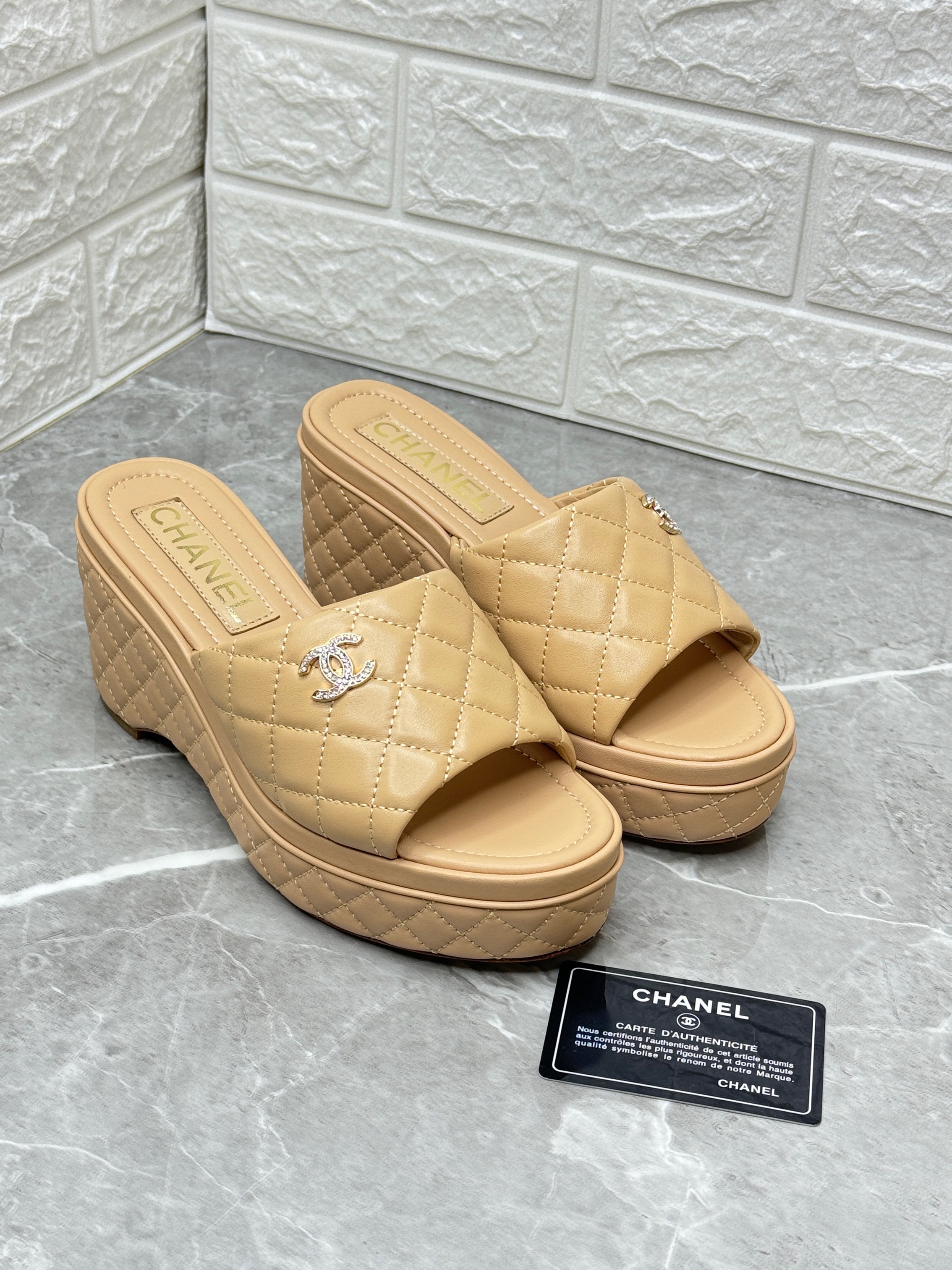 Chanel Lambskin Quilted CC Mules Wedge Sandals in beige. image 1