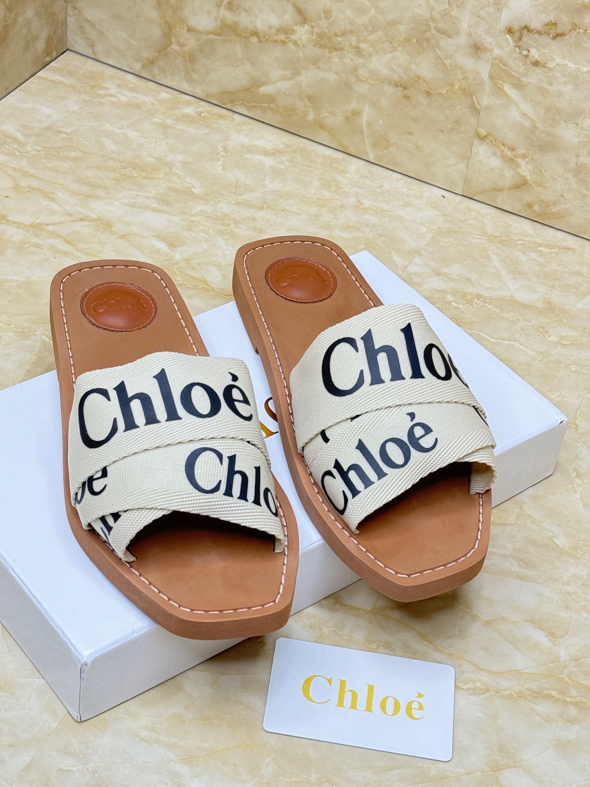 Chlo? Woody flat mules in canvas with logo-printed straps. image 1