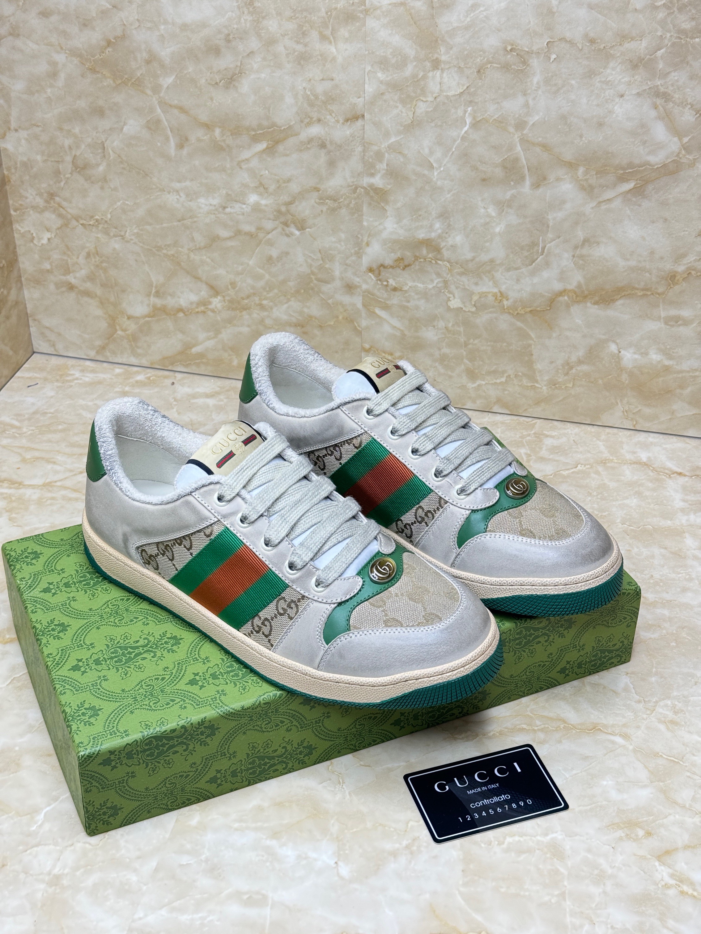 Gucci Screener sneakers in white leather and GG canvas with the signature green and red Web stripe. image 1