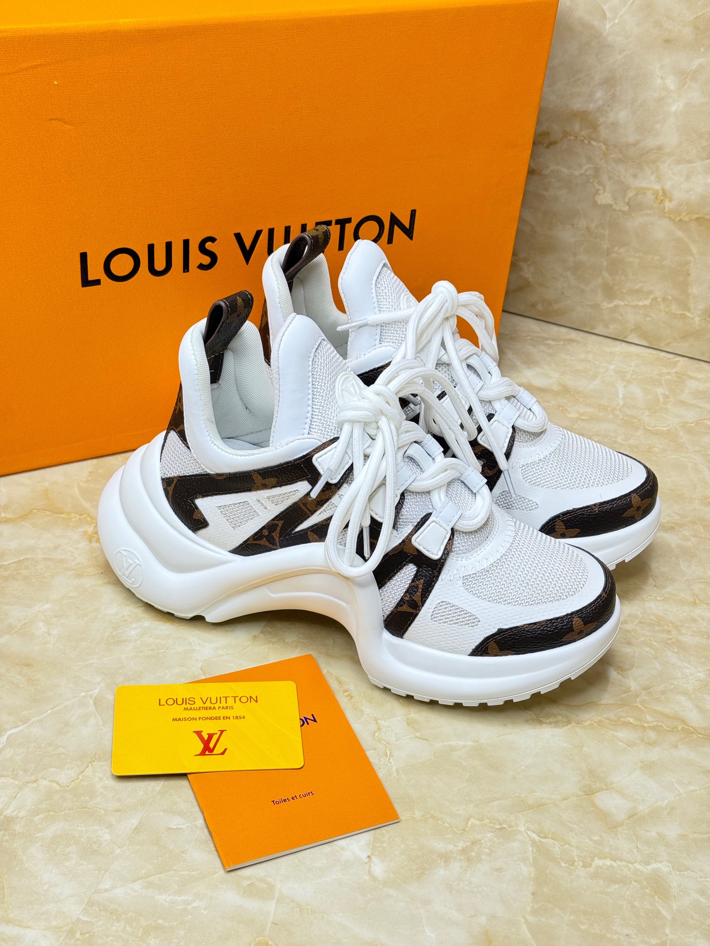 Louis Vuitton LV Archlight sneakers in white with black contrasting accents. image 1