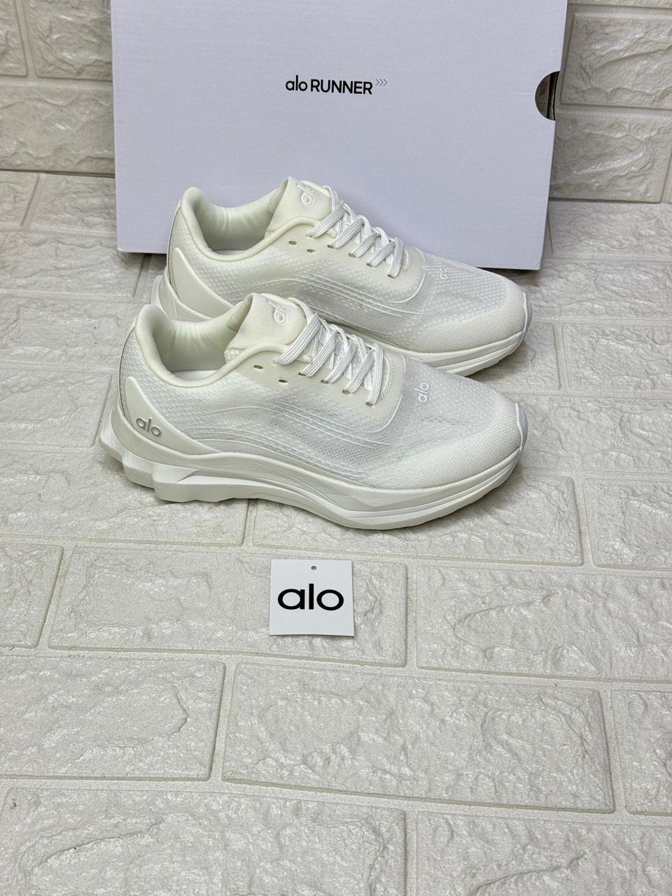 Alo Runner unisex performance shoes in the White/White colorway. image 1