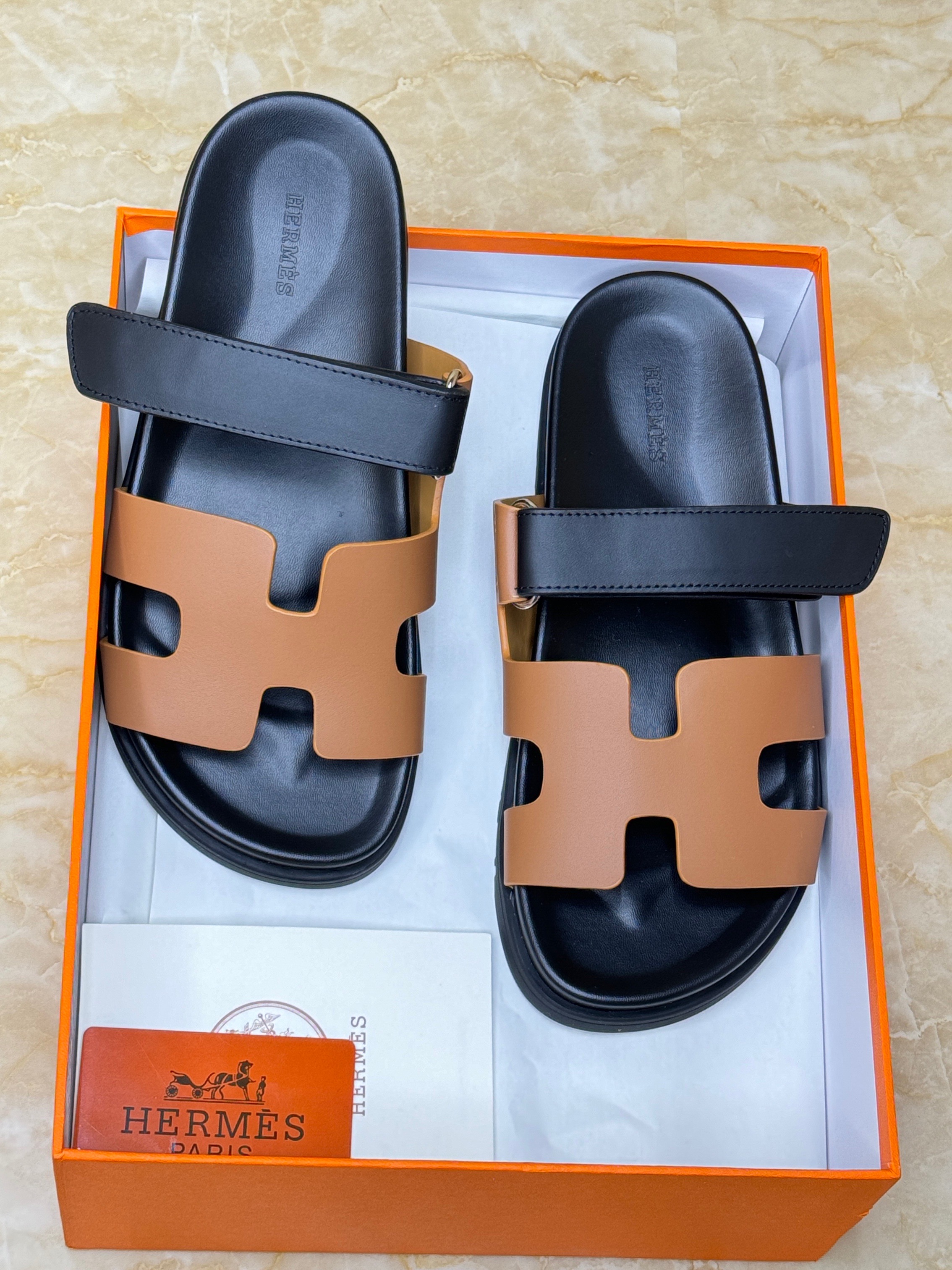 Herm?s Chypre techno-sandals in black and natural calfskin leather with an anatomical rubber sole and adjustable strap. image 1