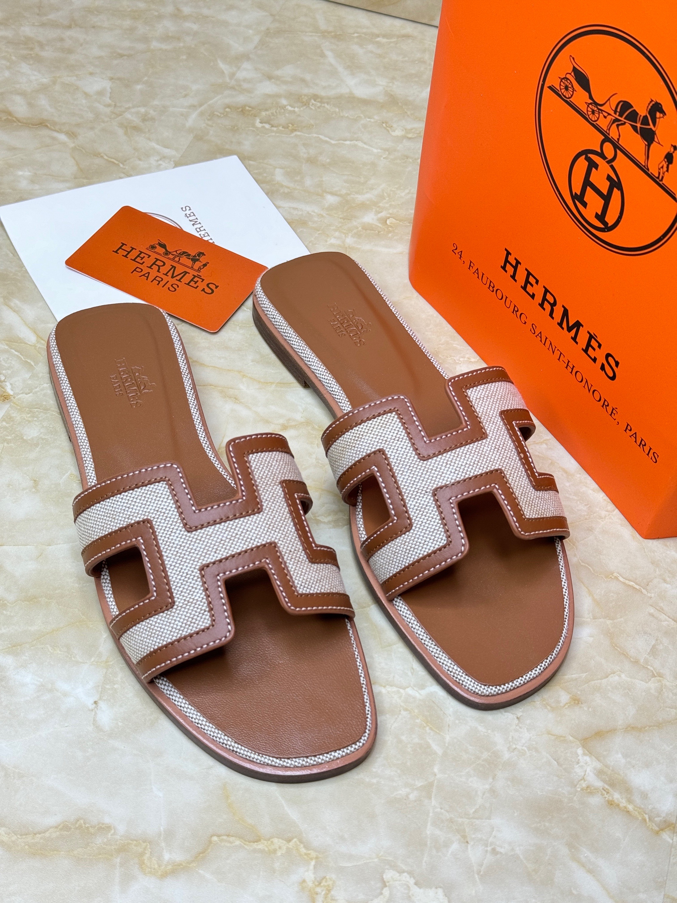 Herm?s Oran sandals in brown and beige canvas and leather. image 1