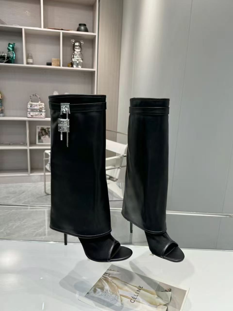 Givenchy Shark Lock high boots made from smooth calfskin leather, featuring an almond toe, a signature leather band with a metal clasp, and 4G padlocks on the sides. image 1